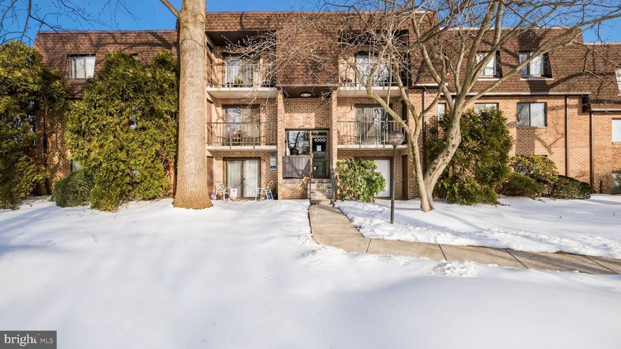 Welcome to your bright and airy retreat in the heart of Goshen Valley! This 2nd-floor condo at 1011 Valley Drive offers the perfect blend of comfort and convenience. Step inside to find brand-new carpeting throughout and a massive living area bathed in natural light. Currently serving as a dual-purpose lounge and executive workspace, this versatile room opens directly onto a private balcony with peaceful, scenic views—the ultimate spot for your morning coffee.
The open-concept dining area leads to a kitchen ready for your personal touch, while the oversized bathroom conveniently houses a full-size stackable washer and dryer. Retreat to the primary suite, featuring double closets for impressive storage, or utilize the second bedroom as a dedicated nursery or cozy reading nook. Enjoy maintenance-free living with community perks like a pool and tennis courts, all within the award-winning West Chester Area School District.  Best of all, you are just minutes from the vibrant heart of West Chester Borough, where you can enjoy an incredible array of premier shopping, local boutiques, and acclaimed dining destinations.