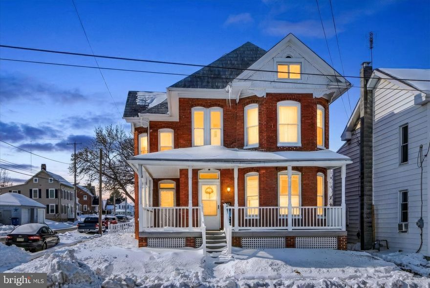 BAY WINDOWS really Light Up this Brick Victorian 3 BR, 1.5 BA home! Perfectly poised on the corner to showcase the wrap around porch and maximize its sunny Southern exposure.  High ceilings, wood flooring and bay windows maximize the living space.  The attic is an opportunity to add two more bedrooms, if desired.  Conveniently located in Littlestown Boro, this property is in the Town Center Mixed Use (TCMU) District zoning district which affords additional opportunities.  Zoning info available upon request.  Plenty of off-street parking, grassy back yard and covered porches for friends and family to visit.  Composite decking on the both the front and back porches!  Kitchen was remodeled just prior to the seller's purchase and is spacious enough for a full-sized table.  Sale is dependent upon seller finding new home.  Schedule your showing today!