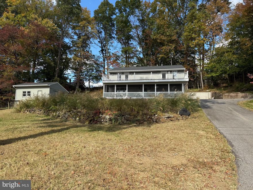 FULLY RENOVATED HOME ON THREE LOTS IN WATER-ORIENTED COMMUNITY OF LOCH HAVEN BEACH! WELCOME TO THIS BEAUTIFULLY 3 BEDROOM POTIENTIALY 4 BEDROOM JUST ADD A DOOR (CURRENTLY CAN BE USED AS COMMUNITY OR BONUS  ROOM WITH DOOR EXITS ON TO DECK,  3 1/2 BATHS WITH PEACEFUL SETTING. EACH BATHROOM OFFERS LIGHT AND VENT FIXTURES EQUIPPED WITH BUILT IN BLUETOOTH SPEAKERS, ALL BEDROOMS HAVE SMOKE DETECTORS HARDWIRED WITH BATTERY BACKUP, SHED AND ATTIC PULL DOWN WITH BLOWN INSULATION ADDITIONAL ELECTRICAL WIRING POTENTIAL GARAGE OR PRIMARY BEDROOM. ENTER INTO THE OPEN MAIN LEVEL BRAND NEW LUXURY VINYL PLANK FLOORING, NEW ROOF, NEW HVAC SYSTEM, NEW WATER TREATMENT SYSTEM PROVIDING MODERN STYLE AND PEACE OF MIND FOR YEARS TO COME. COMMUNITY AMENITIES; PLAYGROUND, BASKETBALL, TENNIS, PICKLEBALL & VOLLEYBALL COURTS, BOAT RAMP WITH WATER ACCESS AND PICNIC AREA. THIS MOVE IN READY HOME OFFERS THE PERFECT BLEND OF COMFORT, RECREATION, AND NEIGHBORHOOD CHARM!!