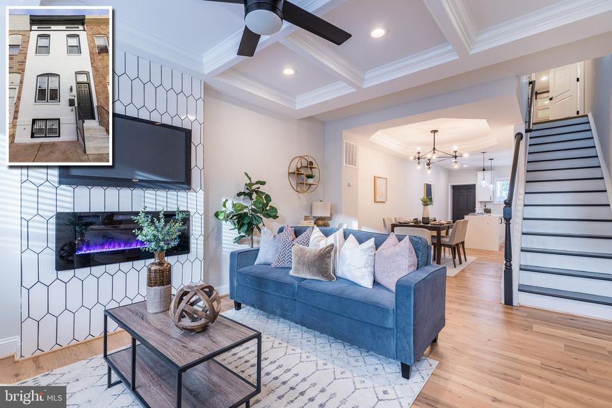 CUTTING EDGE RENOVATION WITH 3 FINISHED LEVELS, ROOFTOP DECK, OFF STREET PARKING, AND 27K IN AVAILABLE GRANTS TO HELP PAY YOUR CLOSING COSTS AND LOWER YOUR MORTGAGE!  This is not your typical cookie cutter renovation and has all new electric, plumbing, and HVAC with permits pulled.  The welcoming main level features a spacious living room w/ coffered ceiling, fireplace, and exposed brick and leads into the separate dining are w/ tray ceilings.  The attractive island kitchen features custom pendant lighting, Quartz counters, ss appliances, and a tile backsplash.  The upper level offers 2 generously sized bedroom suites with full baths w/ custom tilework.  The finished basement has 2 additional bedrooms, 1 full bath, and a hall wet bar.  The rooftop deck is the perfect place to unwind with a fireplace and space to add an exterior TV, plenty of privacy, and sweeping views.  Parking is not a problem with the fenced in parking pad for added security.  This property is located a short walk to Johns Hopkins Hospital and is eligible for the 17K Live Near Your Work Grant, 10K Vacants to Value Grant, & 5 Year New Construction Tax Credit!