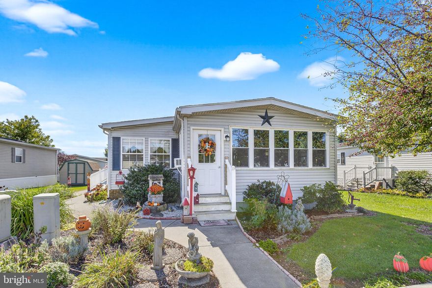 Enjoy easy living in this double wide mobile home that has 3 bedrooms and 2 full baths.   This spacious home has an open floor plan with a lot of natural light.  If you enjoy cooking, the Kitchen has a desirable gas stove and plenty of cabinets for storage.  There is a breakfast nook as well as a dining area just in case you have some company.  The Living Room has a natural gas fireplace with mantle for decorating.  The Primary Bedroom is nicely sized and the large adjoining Primary bathroom has a skylight for extra natural light.  There are 2 more bedrooms and another full bathroom with a traditional tub and shower and another skylight.  You will love the enclosed porch; use it as a large dining room  or as a sitting room.  Electric baseboard heat could likely be easily added for additional living space year round.  Sit outside on the outside patio or sit back and relax on your covered front porch and let time pass by.   There is a newer 16x10 outdoor shed with electric to house a lawnmower, gardening tools, bicycles, etc..or it may make a nice workshop/mancave...This home is well taken care of and lightly lived in.  Economical Natural Gas Furnace, stove and fireplace.  

About Shadow Stone Village:  This development is a master-planned Community for adults 55 and older. This vital, active adult Community provides the warm fuzzy feel of a friendly neighborhood, the sweeping beauty of a gem-like, natural setting and easy proximity to the culture and vibrancy of nearby cities such as Hershey, Mount Gretna, Annville and Harrisburg without any big-city hustle or hassles.
  Shadow Stone residents are offered a calendar of activities and have access to an updated fitness center, exercise classes, a large spacious community Center with a chef's kitchen, a library, a social center for family gatherings, and amenities such as barbecues, resident activities, dinners, travel clubs, and monthly restaurant outings. Shadow Stone is a community where you can thrive, enjoy your friends and make new friendships along the way! 
 
We welcome your beloved indoor furry friends as well with no Pet Deposit. And it is a great place to walk, hike, dine and live!
Some activities include:  Yard Sales Twice A Year, Monthly Pot Luck Dinners and an annual Christmas Dinner for the Residents plus much more!
Sale is contingent on Seller finding suitable housing