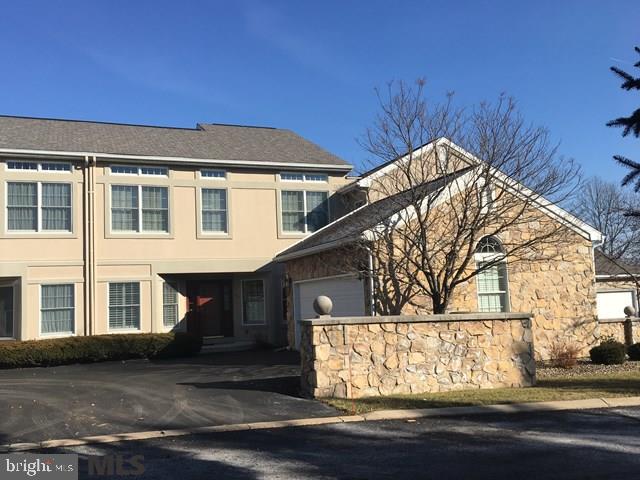 Wake up each morning to an incredible view o f Mt Nittany. Rear deck and patio border Centre Hills Country Club Golf course for priceless privacy and wonderful feel of open space. Stately architectural columns garnish the living and dining rooms. With towering 2 story ceiling in the living room. focusing on the gas fireplace. Wet bar and gas fireplace in spacious walk out lower level family room. Impressive master suite with spacious walk in closet, corner jacuzzi tub, dual vanities and a separate shower. Carefree living in well managed condo community with Crossing Park and bike/walking path immediately accessible.