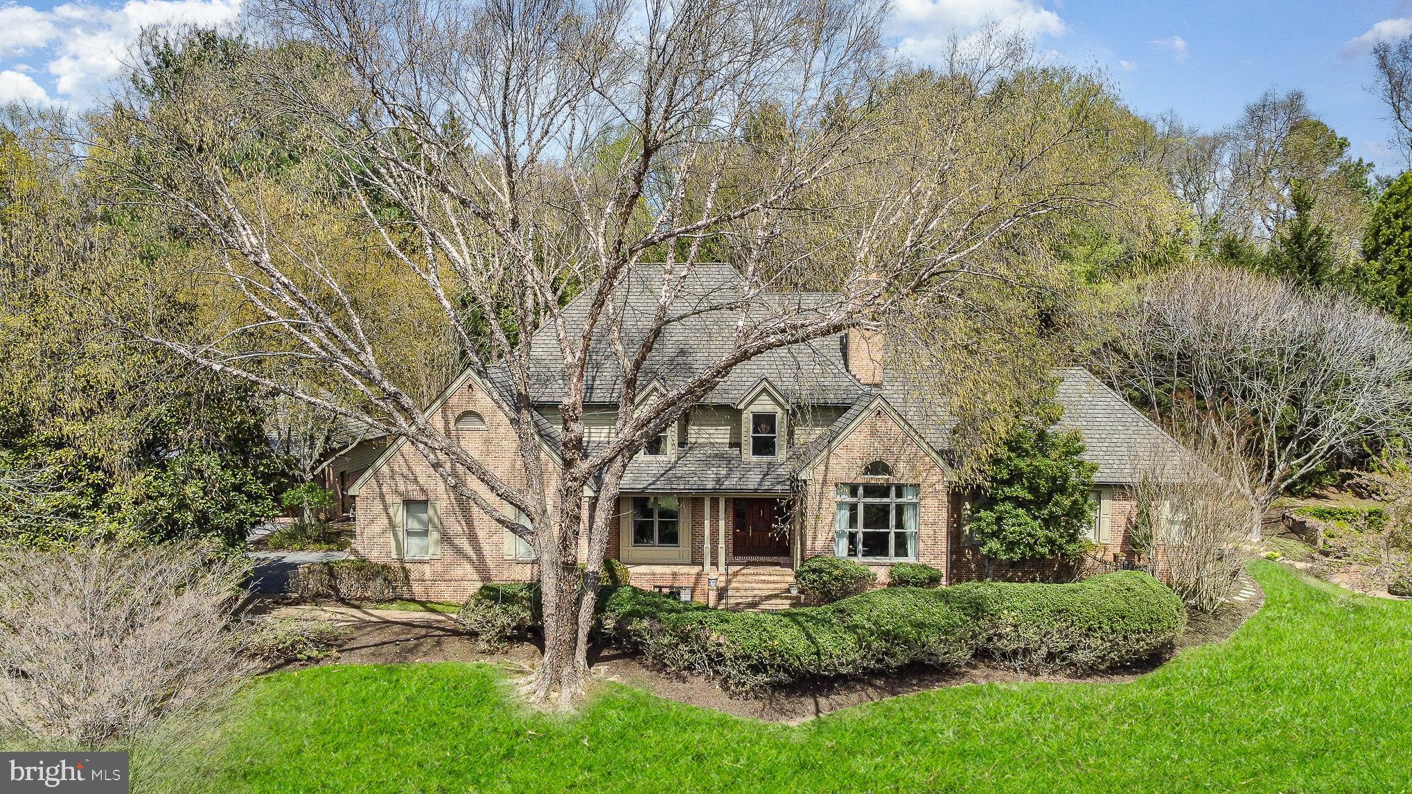An outstanding French Country estate offered for the first time in 30 years. Perched on a hilltop and nestled on a secluded lot just off Falls Road (@Broadway Road) and only 2 miles from Greenspring Station, the Beltway (I-695) and the Jones Falls Expressway (I-83). This home boasts 8,000 +/- sq. ft. and includes 5BR/6.5BA, with incredible indoor and outdoor living and entertaining areas. The spacious first floor primary suite exudes luxury with a vaulted bedroom ceiling, gas fireplace, gorgeous white marble bathroom and a huge custom his/hers closet area with deluxe custom cabinetry befitting the finest boutique. Additional interior features include a sensational den/study with handcrafted Cherry wood, a light drenched great room with soaring ceilings, chef's kitchen and a brand new screened sunroom with built-in heaters, bluestone flooring and overlooking a tranquil waterfall. A dry sauna and separate steam shower. All bedrooms are ensuite and very generous in dimensions. Additional exterior features include a resort like kidney shaped swimming pool with a very unique cabana (kitchen and bath) and exceptional entertaining areas which include firepit and performance stage. Garage parking for 5 vehicles with a lift making it 6 vehicles (expandable to 8) and professional mature landscaping throughout.
