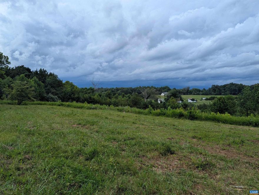 Gorgeous setting with year round, sweeping mountain views, overlooking picturesque farmland. Complete privacy but only 15 minutes to Hollymead Town Center. Mixture of mature hardwoods and open field. Underground power already install to the property. Driveway will shared with one other residence and 70% installed to house site location. Custom home package also available. Owner/Agent.