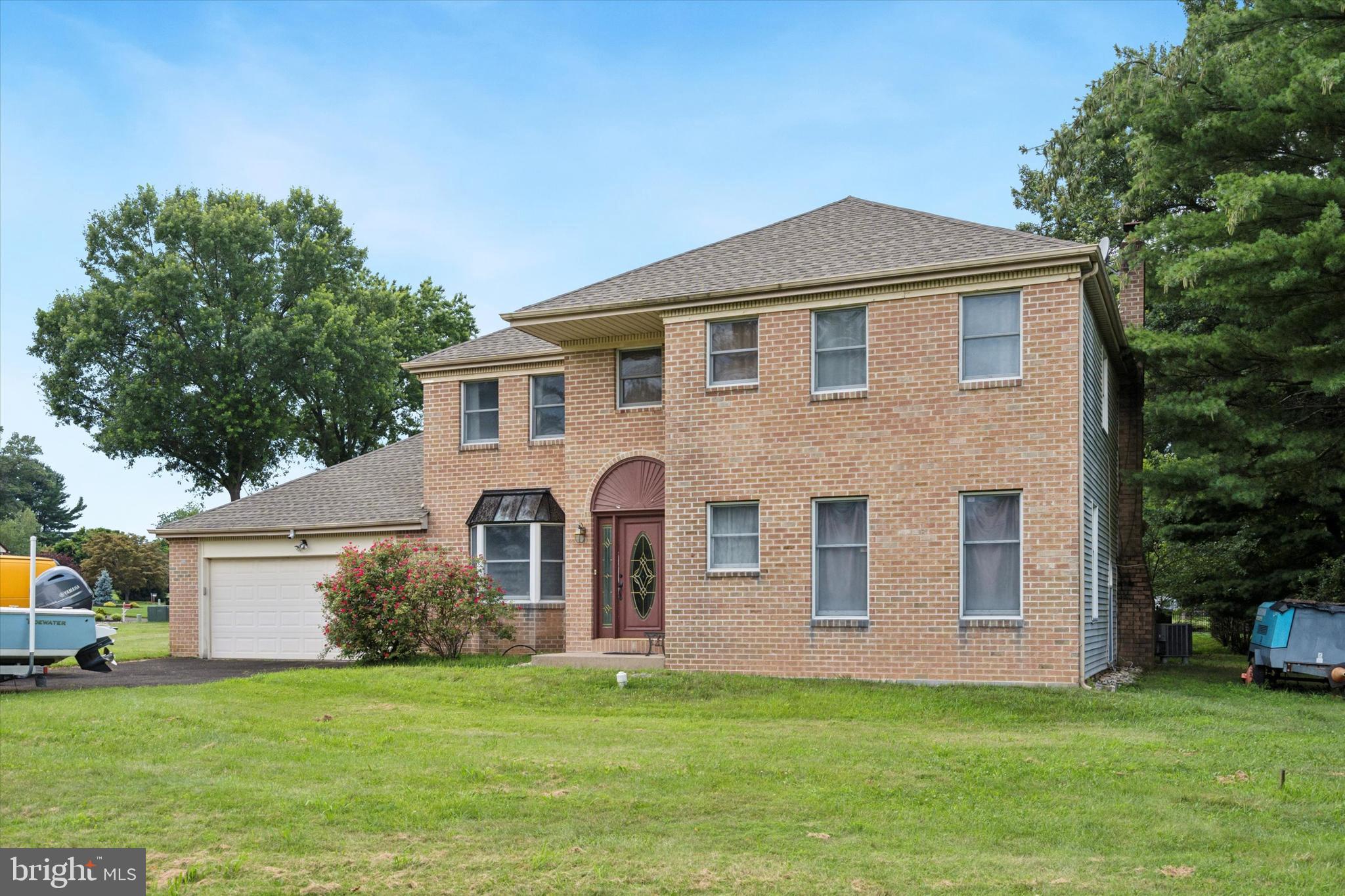 Your beautiful new home in Council Rock School District just hit the market! Sitting on a large corner lot, this 4 bedroom, 2.5 bathroom home offers plentiful features inside and out and provides fantastic spaces to enjoy with family and friends! Start in the grand foyer, with high ceilings and chandelier lighting, where you'll find the formal living room on your right that could easily double as a den or office space. Head the other way through the formal dining room to the large eat-in kitchen showcasing island with breakfast counter, electric oven with vent hood, plentiful cabinetry and counter space, a desk area, and room for a table. A few steps down, and you're in the spacious family room with stone fireplace centerpiece. The main floor also includes a powder room and laundry room. Upstairs in the sleeping quarters, begin with the owner's suite with ensuite bath featuring oversized dual sink vanity and walk-in shower. Three additional bedrooms and hall bath complete this level. Additional features of the home include recessed lighting, hardwood and tile flooring throughout, attached 2-car garage and driveway parking. The home is surrounded by yard space but the best features are in the fenced backyard complete with multi-level deck, paver patio space, and in-ground pool - imagine the entertaining possibilities! This beautiful home has so much to offer its next owner - make some time to see it and make it yours for years to come!
