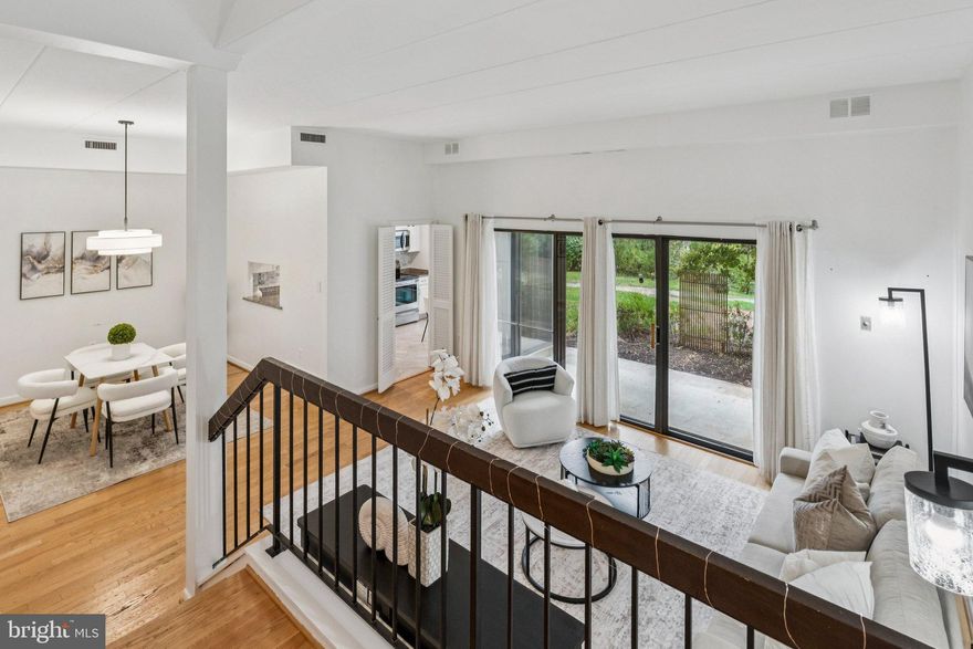 Welcome to 102 Roberts Lane Unit 100, a beautifully updated 1.5-level condo in the sought-after Fort Ellsworth community of Old Town Alexandria. This spacious home features soaring ceilings, hardwood floors, oversized windows, and sliding glass doors that fill the space with natural light. The renovated kitchen offers a brand new refrigerator, stainless steel appliances, granite counters, and a tile backsplash. Both bathrooms are elegantly updated with separate vanities and a walk-in, rain head shower. Included is a High-end GE Profile washer/dryer combo offering quiet operation, advanced fabric care, and seamless wash-to-dry convenience. The ground floor unit includes a private patio with extra storage, abundant closet space, and assigned parking (#173). Pet-friendly community with pool, party room, tennis courts, and picnic area. Prime location near King Street Metro, VRE, and all Old Town amenities. Condo fee includes heating, cooling, and water; only electric and cable extra.