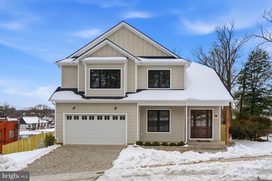 Experience luxury living at its finest in this spectacular new construction on Williamsburg Blvd in Arlington’s sought-after Berkshire Oakwood neighborhood. From the grand foyer, you’ll immediately notice the soaring ceilings on all three levels, expansive black-frame windows that flood the home with natural light, and wide-plank white oak floors that set a warm, elevated tone throughout. Designed for both everyday comfort and unforgettable entertaining, the main level features an extraordinary open layout with a showstopping gourmet kitchen—complete with an oversized island with seating, premium stainless steel appliances, an expansive walk-in pantry, and a sunny breakfast nook with access to the rear deck. The adjacent family room offers a cozy gas fireplace, while the separate formal dining room with coffered ceilings is perfect for hosting. A versatile main-level office/bedroom includes a closet and ensuite full bath. You’ll also love the thoughtfully designed mudroom with built-ins, sink, and full-size laundry, offering dual access from the interior and the oversized two-car garage. Upstairs, retreat to an impressive primary suite with cathedral ceiling, sitting area, mini bar, and two walk-in closets. The spa-inspired bath is straight out of a magazine—double vanities, dual showers, and a soaking tub for the ultimate unwind. The secondary bedrooms are beautifully planned: two share a Jack-and-Jill bath, while another enjoys a private full bath. A second upper-level laundry room with cabinetry and counter space adds everyday ease. The walk-out lower level is an entertainer’s dream with a spacious recreation room, large wet bar, dedicated fitness area, and a sixth bedroom with full bath—ideal for guests. Step outside to a fenced backyard with pavers, perfect for relaxing or hosting. Commuters will appreciate easy access to I-66, and you’re also conveniently close to East Falls Church & Falls Church Metro, Falls Church City favorites (Farmer’s Market, Whole Foods, shops, and restaurants like Thompson Italian and Clare & Don’s), and just minutes to Tysons Corner. Zoned for Nottingham ES / Williamsburg MS / Yorktown HS.