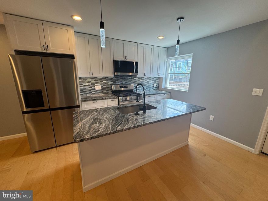 2731 Mura St – Where Style Meets Convenience in the Heart of Baltimore

Imagine stepping into a space where every detail feels just right—where modern luxury meets timeless charm, and where you don’t just live... you arrive.

This gorgeously renovated 3-bedroom, 3-bath townhome is more than a place to rest your head—it's a statement of who you are and the life you're building. From the moment you walk through the door, you’ll feel the difference: the open floor plan flows effortlessly, the natural light pours in generously, and the craftsmanship whispers, someone took pride in this.

Why does this home feel so different?
Because it was designed to feel like home the moment you step inside. The kitchen—complete with sleek finishes, stainless steel appliances, and elegant countertops—wasn’t made just to look good in photos; it’s built for real life. Picture yourself hosting friends, unwinding after a long day, or just enjoying your morning coffee in a space that feels intuitively right.

Each of the three full bathrooms is a retreat of its own—featuring high-end tilework, modern vanities, and clean lines that make everyday routines feel like self-care rituals.

Upstairs, the bedrooms are surprisingly spacious—yes, even the secondary ones—with thoughtful touches that make it easy to imagine your furniture already in place. The primary suite? Let’s just say… you’ll look forward to coming home every night.

Freshly renovated means peace of mind.
New systems, new finishes, and nothing left for you to do but move in and start living. It’s clean, it’s crisp, and it’s calling your name.

Location matters.
Nestled in the heart of East Baltimore, you're minutes from Johns Hopkins, downtown, and major commuter routes like I-895 and I-95. Whether you're a student, a professional, or simply someone who knows value when they see it—you’re in the right place.

Does it make sense to rent a fully renovated home with all this space, in this location, at a price that still leaves room in your budget for life? Most people say they want more for their money. This is what "more" looks like.

Here’s the question: What would it feel like to live here?

Because if you’re like most people, the second you walk in, you’ll know—you’re not just renting a house… you’re claiming a home.

Schedule your private tour today before someone else does.

Let’s make this move make sense—for you.