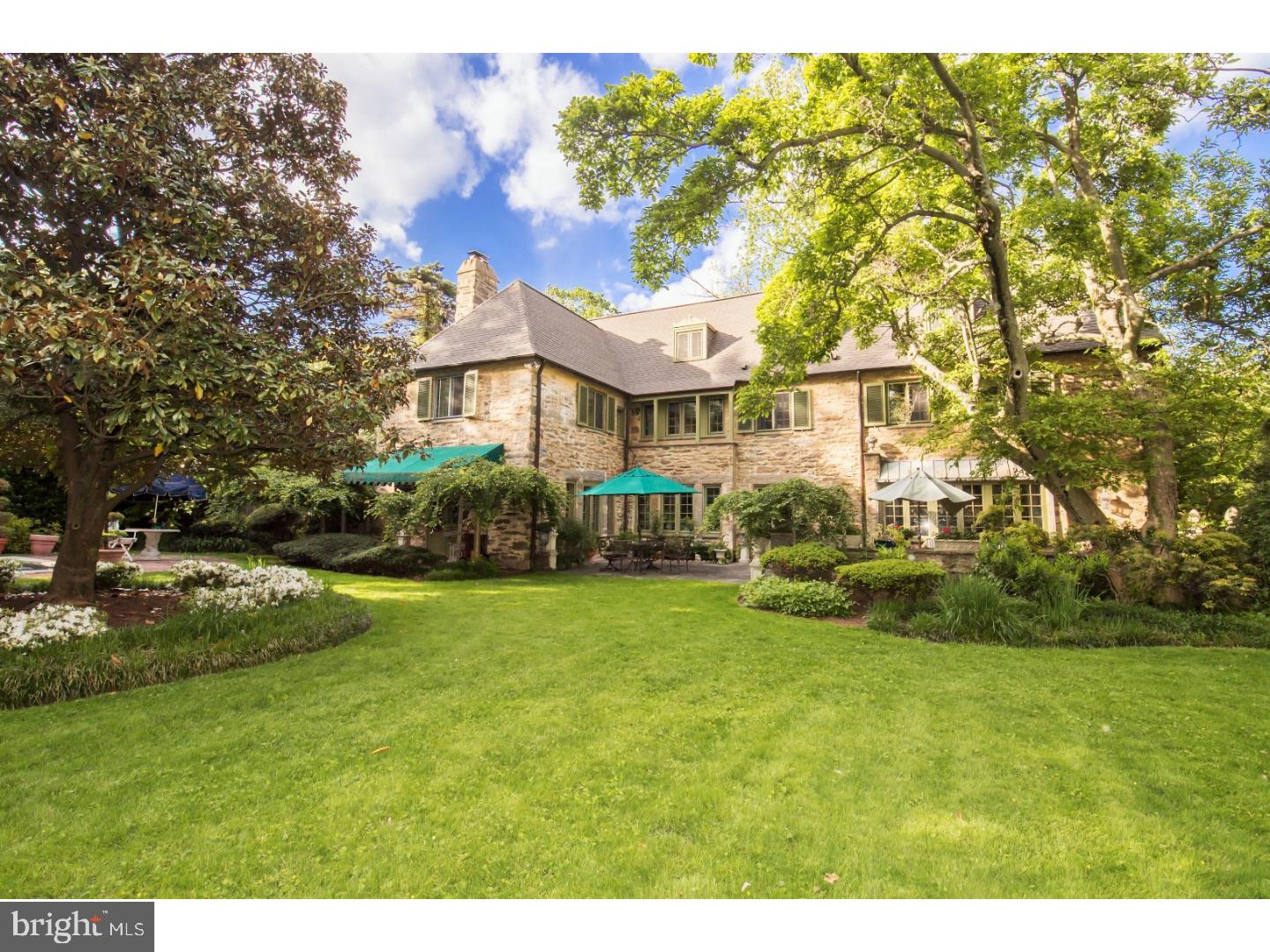 This stately Norman style house, designed by Willing, Sims and Talbutt for Dorothy Falcon Platt, and built in 1923, is truly exceptional. Mrs. Platt, a noted horticulturalist and artist, created an unparalleled garden oasis, and the original landscape design has been thoughtfully maintained. The home's design features this garden as an extension of the house, with French doors to the terrace from both the living and dining rooms, and broad windows in the gallery connecting the two rooms. The tall garden wall adds both architectural interest and privacy. A beautiful lap pool for exercise or entertainment has been added to the garden. The lovely first floor interior has living and dining rooms, each with fireplace, butler's pantry and kitchen with adjacent den or breakfast room. The home features three bedrooms and two baths on the second floor, including master suite with fireplace, bath, and dressing room.The third story includes bedroom, bath, study, and extensive storage area. Multiple architectural elements grace the house- balconies, terraces, large fireplaces, handsome millwork and moldings, exposed beams, wide plank floors, large windows, and high ceilings. Incredibly, this private home is just steps away from the shopping and dining of Chestnut Hill, and less than thirty minutes to Center City by car or train.