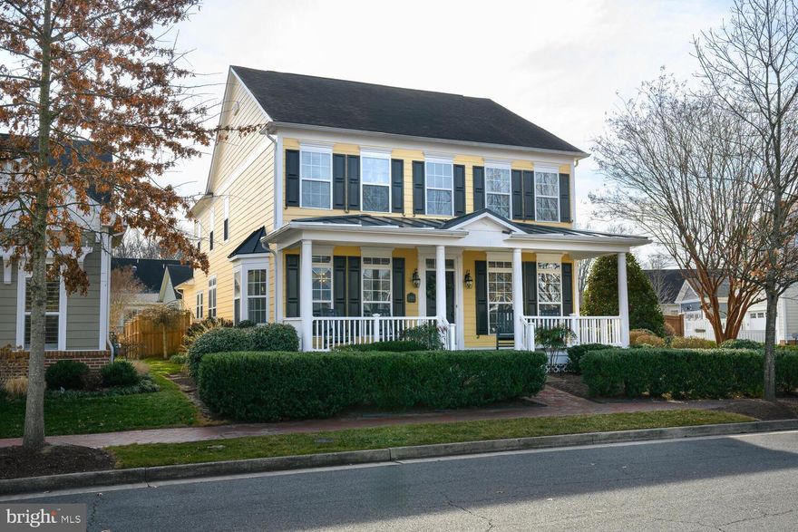 Ideally located in the highly sought-after waterfront community of Easton Village, this beautifully maintained home offers nearly 3,000 square feet of refined living just minutes from downtown Easton, St. Michaels, and Oxford, and conveniently close to Easton Airport with jet service—perfect for those seeking an effortless Eastern Shore lifestyle.   Set on a premier, oversized corner lot, the property is enhanced by manicured landscaping, irrigation, and full privacy fencing, providing exceptional space and seclusion ideal for family living, entertaining, children, and pets. Inside, Brazilian cherry hardwood floors, crown molding, and nine-foot ceilings create a warm, light-filled atmosphere throughout.   The thoughtfully designed floor plan includes four bedrooms, two full bathrooms, and a half bath, highlighted by a spacious primary suite with dual walk-in closets, while a recently updated secondary full bath adds modern appeal.   Just off the main living area, a charming den nook offers a cozy and flexible retreat—perfect for a reading space, home office, or quiet sitting area.   The inviting kitchen features rich wood cabinetry, granite countertops, a mosaic tile backsplash, stainless steel appliances, recessed lighting, and a generous breakfast bar, making it ideal for everyday living and gatherings.   A formal dining room with tray ceiling and a cozy gas fireplace further enhances the home’s elegant yet comfortable living spaces.   Additional highlights include a freshly painted Hardiplank exterior, conditioned crawl space, and a detached two-car garage with alley access.   A picture-perfect covered front porch, framed by mature landscaping, offers a welcoming place to relax and enjoy the neighborhood. Residents of Easton Village enjoy resort-style amenities including a clubhouse with fitness center, pool, scenic walking trails, bocce court, kayak storage, private beach, and a community marina with direct access to the Tred Avon River, delivering the very best of Eastern Shore living.