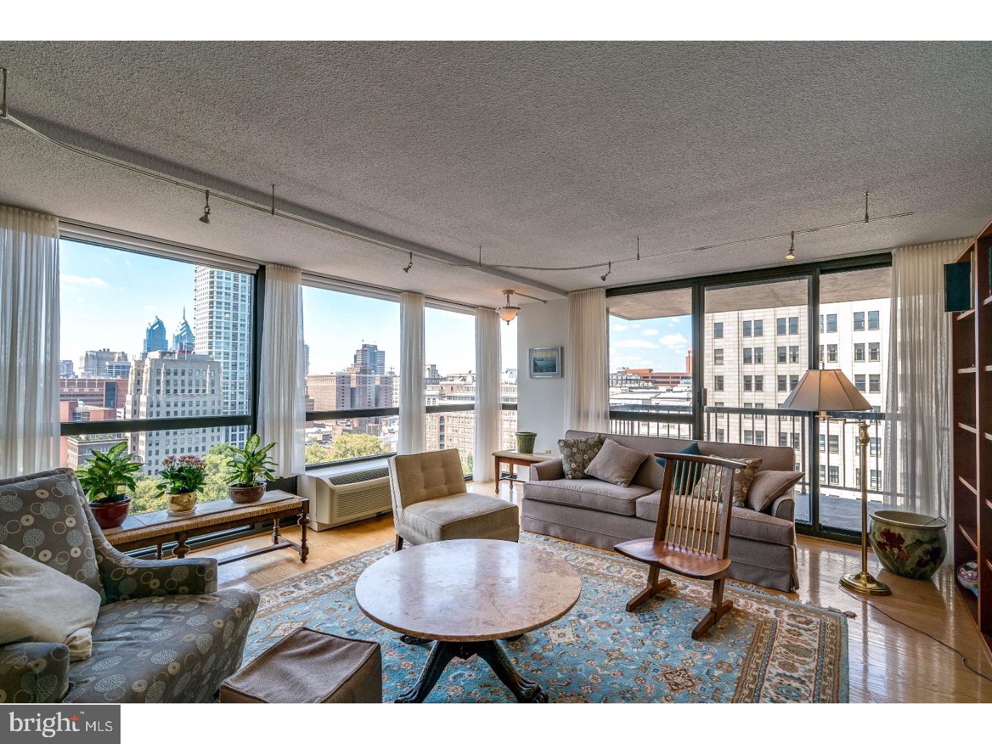 Completely renovated, one-of-a-kind three bedroom, two bathroom at the highly coveted Independence Place on Washington Square. The home boasts a spacious great room open to an adjacent dining room, with walls of floor-to-ceiling windows and a private balcony with jaw-dropping Washington Square and Center City skyline views. The fully upgraded kitchen features white wood cabinetry, granite countertops, Bosch dishwasher and oven, refrigerator with built-in water dispenser, subway tile backsplash, stainless steel appliances, under cabinet lighting, built-in lighting with dimmers, and excellent storage space. Enter the master bedroom through French doors, into a light-filled room with a large walk-in closet and marble appointed bathroom with his-and-hers sinks and an oversized walk-in shower. The two additional bedrooms have wall closets and easy access to the renovated, marble appointed hallway bath. Additional highlights include a laundry room with side by side washer and dryer, recessed and track lighting, and excellent storage space throughout. Independence Place is comprised of two towers: One Independence Place and Two In-dependence Place, both built in 1983 and are comprised of 487 units total. Residents of Independence Place enjoy a twenty-four hour doorman and concierge, a beautifully appointed lobby on the main level, on-site management, and individual heat & air conditioning controls. On-site garage parking is available for a fee.   Location is everything... Independence Place is located in the historic Society Hill neighborhood of Philadelphia facing Washington Square. Many of the city's finest museums, cultural institutions, theaters and restaurants are only a short walk away.