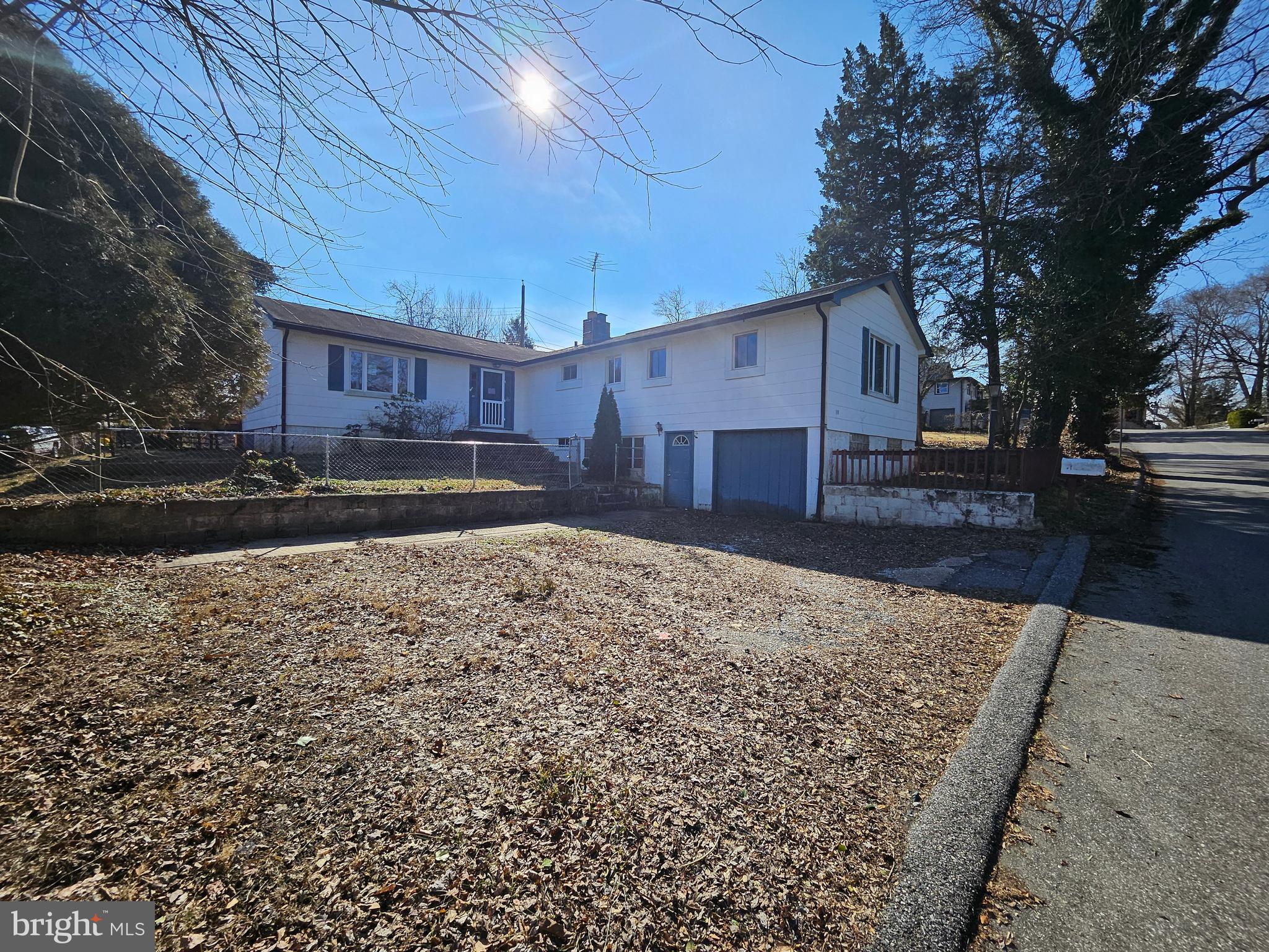 This is a Fannie Mae Homepath Foreclosure. Great house, offering so much space in a community in Riva. The entry foyer can lead you to the left additional living area with slider to the rear deck, or straight ahead to the door leading to the deck and kitchen or to the right leading to the open kitchen, living room and dining room combo. The combo of those 3 rooms leads to the primary hallway with full bath and bedroom. The right of the combo leads to the bedroom hallway with full bath, two more bedrooms and one with a sitting room. Yet wait, it also leads to the lower level offering yet again more space in a rec room with fireplace, half bath, utility room and garage access. The rear deck has access from the extended living area and off of the kitchen. The lot ends at the wall on the right side of the house. The steps to the patio belong to another lot.