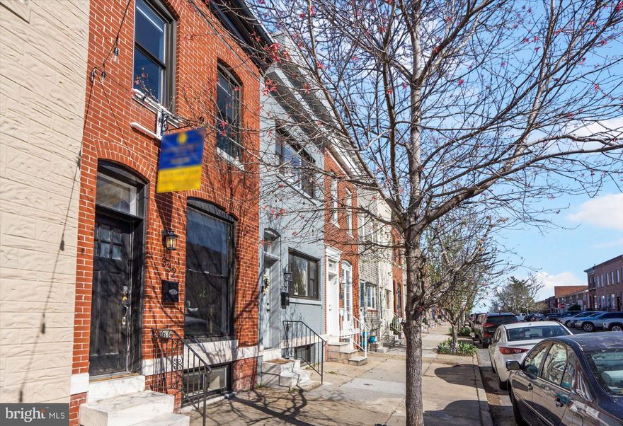 This house has everything you want out of your Highlandtown row home.   Just renovated 5 years ago,   hardwood floors throughout, granite countertops, stainless appliances, exposed brick on first level, and master bedroom.  Interior access to the rooftop deck with 360 views of the city! Parking is a breeze in this parking pad, wide alley, no close turns.  Basement boasts 7 foot ceilings, another bedroom and full bathroom.  Short walk to tons of shopping and restaurants.  Make your appointment asap, this surely will not last long!