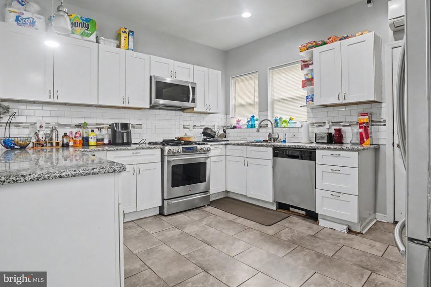 Welcome to this  end-of-row home in the heart of West Philadelphia! This spacious property features 3 bedrooms and 2 full bathrooms. Step inside to an open-concept layout highlighted by rich wood flooring and modern recessed lighting throughout. The kitchen is equipped with stainless steel appliances, including a built-in microwave, dishwasher, and double-door refrigerator, granite counter tops and amble cabinets. The inviting living area showcases a stylish stone mantel with an included electric heater, adding warmth and character to the space. Upstairs, you’ll find three generously sized bedrooms with ample natural light. The finished basement provides additional living space along with a washer and dryer for added convenience and an additional full bathroom. The home has central air and forced heat. Outside, enjoy a fully fenced-in yard.  Currently tenant-occupied with a long-term lease in place; however, the property can be delivered vacant if desired. Don’t miss this opportunity to add to your investment portfolio—perfect as a tenant-in-place investment or for owner occupancy. Schedule your appointment today!