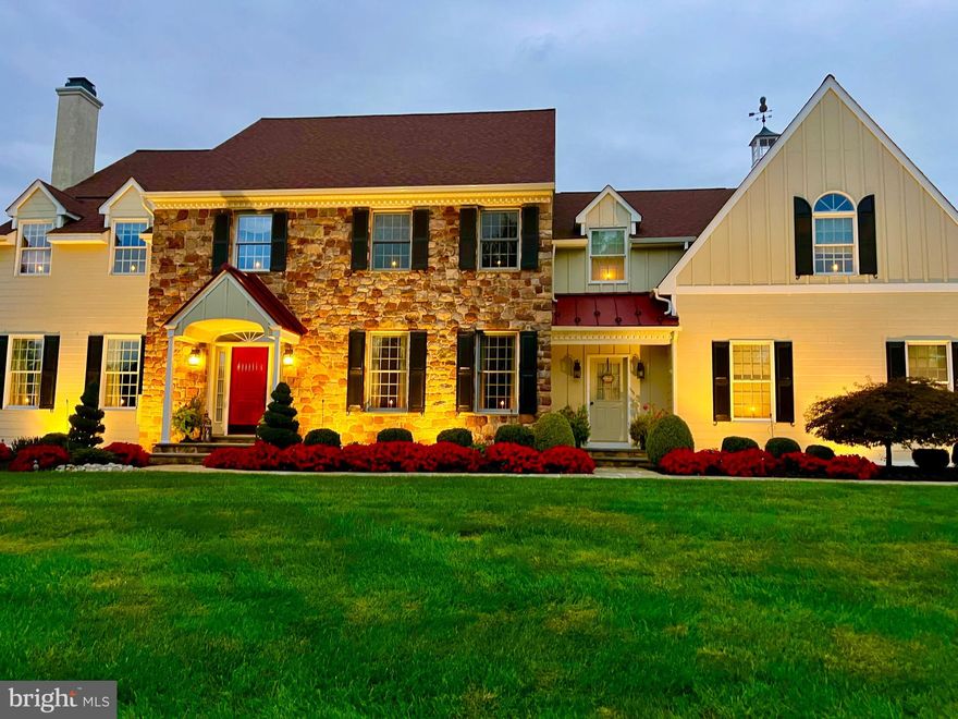 Discover an exceptional Bucks County retreat at 1100 Pineville Road, set on over two acres of beautifully landscaped grounds just moments from New Hope, PA and Doylestown, PA. A long, private approach framed by mature trees leads to this impressive stone residence, where refined craftsmanship and modern comfort come together seamlessly. Inside, a dramatic two-story entrance sets the stage for sun-filled, inviting spaces. Rich hardwood floors, extensive millwork, and an easy-flow layout create an atmosphere that’s both warm and upscale. The formal living and dining rooms are perfectly suited for hosting, while a quiet, built-in office provides a polished workspace. The chef’s kitchen serves as the home’s central hub, outfitted with custom cabinets, granite surfaces, premium appliances, and a generous island. A bright breakfast area opens to the soaring great room, where a striking stone fireplace and sweeping windows frame views of the property’s resort-style backyard. The second level offers a serene primary suite—complete with dual custom closets, a spa-quality bath, and a flexible sitting area—along with spacious secondary bedrooms and well-appointed bath. The finished lower level adds another dimension to the home with its full bathroom, dry bar, game and billiards space, stacked-stone theater room with fireplace, fitness area, and multiple lounging zones. Whether entertaining a crowd or unwinding at home, this level is designed to accommodate it all. Step outside to your private escape: a heated pool and spa surrounded by lush plantings and thoughtfully designed hardscaping. A covered pavilion with built-in gas grill and refrigerator makes outdoor dining effortless, while several seating areas offer the perfect backdrop for anything from summer parties to quiet evenings under the stars. With a three-car garage, abundant storage, and attention to detail throughout, this home delivers a rare combination of elegance, comfort, and resort-style living. 1100 Pineville Road offers not just a place to live, but a luxurious lifestyle to enjoy every day and is located in award winning Central Bucks School District. The pictures of the sunset from your new back yard oasis…….priceless!