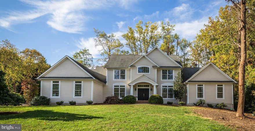 Enjoy resort-style living at one of the newer homes in Poplar Point within walking distance to your deep water boat slip at the Poplar Point marina on the protected waters of Church Creek, with easy access to the South River and the Chesapeake Bay / This 6300+ sq ft home with attached 3-car garage conceals a Gunite swimming pool with waterfall and large level side yard, and also incorporates a detached Pool House & Garage with a deck, outdoor shower and loft storage / The 2-story Foyer introduces 10 ft ceilings, extensive wainscot, elaborate moldings, architectural arches, floor-to-ceiling windows with overhead transoms and white oak floors that extend throughout most of the main level / The Great Room showcases a coffered ceiling which transitions to a vaulted ceiling over the gas fireplace plus sliding doors to a pool-side deck / A handsome main level Library/Home Office displays cherry built-in cabinetry and a contrasting full-length granite desktop / The well-equipped Kitchen features Silestone counters, generous cherry cabinetry, a prominent 2-tier island with bar seating, Jenn Air gas range and additional wall oven, a roomy walk-in pantry and an informal dining area opening to a poolside deck / The bedroom configuration is comprised of a spacious main level Primary Suite with Luxury Bath and 4 large and light-filled upper-level bedrooms / The finished lower level offers great potential for an in-law or au pair suite and highlights an expansive Rec Rm with cherry and granite wet bar, potential 6th Bedroom/Home Office, Full Bath, abundant storage and covered stairs to the backyard and pool / Hardie siding painted Oct. 2021 / The community marina is limited to 30 Poplar Point member homes and offers a clubhouse, kayak and SUP storage, electric & water at the boat slips and a floating dock for launching, fishing and crabbing.