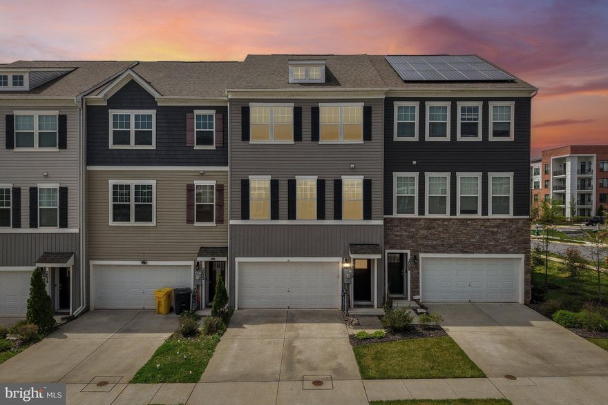 Better than new, this stunning 3-level luxury townhome in Odenton offers over 2,200 square feet of thoughtfully designed living space built in 2019. Featuring 3 spacious bedrooms, 3 full and 1 half bathrooms, and a 2-car garage, this home combines modern comfort with stylish upgrades throughout. The open-concept main level showcases luxury vinyl flooring on every level, a bright and inviting living space, and a well-appointed kitchen with a breakfast area perfect for everyday living and entertaining. The home is enhanced by a custom bar area and a fully finished walk-out lower level providing additional flexible living space. Step outside to enjoy the impressive trex deck or stamped concrete patio, ideal for outdoor gatherings and relaxation. Located in a sought-after community with convenient access to major commuter routes, shopping, dining, and Fort Meade, this home offers the perfect blend of low-maintenance living and upscale design—truly a must-see opportunity.