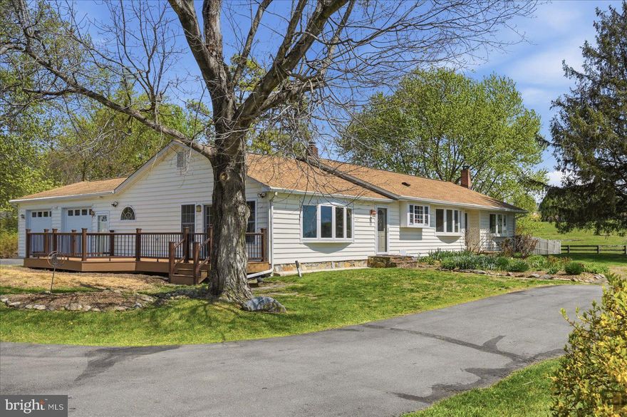 Set on 1.06 acres just outside downtown Charles Town and Ranson, this 4-bedroom, 3-bath ranch-style home offers one-level living with a practical, low-overhead setup that is increasingly hard to find. A paid-off solar array (with $6/mo electric bill), 2-year-old high-efficiency HVAC system, private well, whole-house water treatment with reverse osmosis drinking water, and space for gardening and chickens support a more self-directed lifestyle without sacrificing convenience. The main level includes hardwood and ceramic tile flooring, a bright living room with bow window, formal dining room, kitchen with garden window, spacious primary suite with walk-in closet, soaking tub, separate shower, and private Trex deck, plus a second bedroom, or "princess suite," with its own bath. Two additional bedrooms share a third full bath. Outdoor features include a circular drive, attached 2-car garage with dog wash station, fenced pet yard, patio and garden terrace with retractable awning, and storage shed with potting area. The finished basement adds valuable overflow space with tile flooring, a free-standing wood stove, custom wet bar, and a large storage and laundry room with built-in cabinets. All of this is just minutes from the shops, dining, and everyday conveniences of Charles Town and Ranson, offering an increasingly rare balance of accessibility and room to live more intentionally.