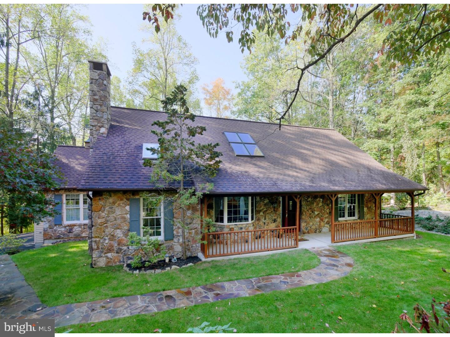 Peace, serenity, and privacy is what you experience when you visit this beautiful Cape Cod style home in Blue Ridge Estates.  Situated on a one acre totally wooded lot, one can enjoy the calming affects of vacationing at a mountain retreat.  If you love nature, you will be fascinated with the little country critters & natural beauty that surrounds you when you sit on the deck or on the covered front porch of this home.   Top quality construction is evident here.  Featured is a wall to ceiling authentic stone fireplace in the LR, stone front across the entire front of the home, & oak floors in the LR, DR, Kit eating area and hall that shimmer.  There are cathedral ceilings in the LR & DR, as well as skylights in both rooms.  A custom cherry kitchen with stainless steel appliances, corian counters, and tile floor make this a cooks delight.  The first floor bathroom has exquisite fixtures that sparkle, has a tile floor and houses the laundry facilities. Also on the first floor are 2 very spacious bedrooms, making it ideal for an owner who needs first floor living.  The 2nd floor features a spectacular Master BR with a custom bathroom .  This bathroom has heated tile floor, A tiled shower with dual shower heads, & more.  There is also a 14' x 6' walk in closet with custom shelving & racks.   Located on the 2nd floor is a wonderful Loft that is great when you want to relax with a good book or escape to watch your favorite movie without interruption. There are 3 very large storage areas on the 2nd floor also, making it convenient to store what ever you hesitate to part with.   The 2 car garage, wrap around deck,  gazebo, and garden shed complete the outside of the property. If you like the county feel but want convenience to shopping, community services, & major routes, this is the home for you.  It has a rustic flair, but is also very refined.