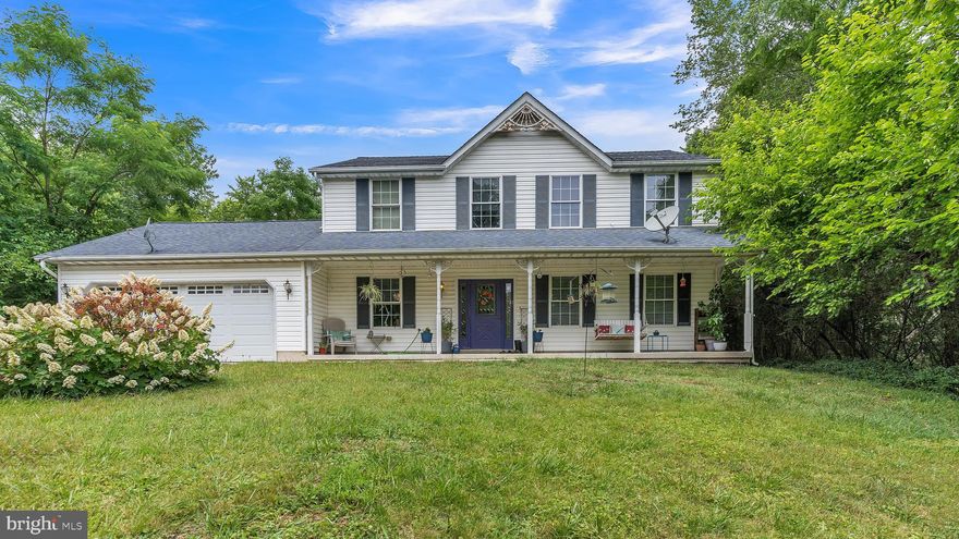Welcome home to this 4 bedroom, 2.5 bathroom single family home with a two-car garage - situated on an 8 acre lot! When you enter the home you will love the abundant natural light that reflects off the tile flooring throughout the foyer and kitchen/dining spaces. To the right of the front door is the spacious living room and to the left you find additional space that could be used as a home office or extended family room space - whatever you need! The kitchen comes fully equipped with ample countertop space and cabinetry - everything you need to make meal prep a breeze. The dining room connects with the kitchen and includes sliding glass doors to enjoy the backyard patio - the ideal location for outdoor dining and entertaining. The laundry is conveniently located behind the kitchen space and this main level is completed with a half bathroom. On the upper level you will find 4 bedrooms, and 2 full bathrooms including the primary bedroom with large closet space and its own private en-suite bathroom. This spacious lot gives you beautiful views and privacy - don’t miss the chance to make this your own!