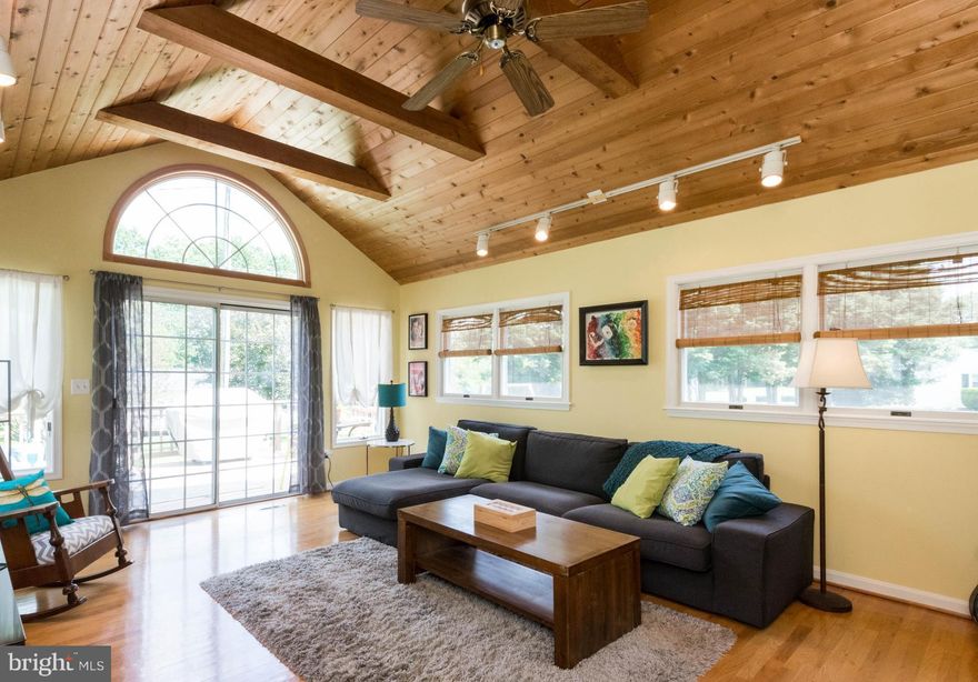 Beautiful rancher in CHATHAM.Large Main Level Family Rom w/windows on all sides & vaulted ceiling can be closed off w/pocket glass doors.Shining Hardwood Floors throughout.Huge Updated Eat In Kitchen  w/ lots of cabinets.Expansive Living Room w/Fireplace.Master has room for King bed & en suite Bath.Renovated Baths.Large closets.Lower Level: Rec Room;Workshop;lots of Storage;Exit.