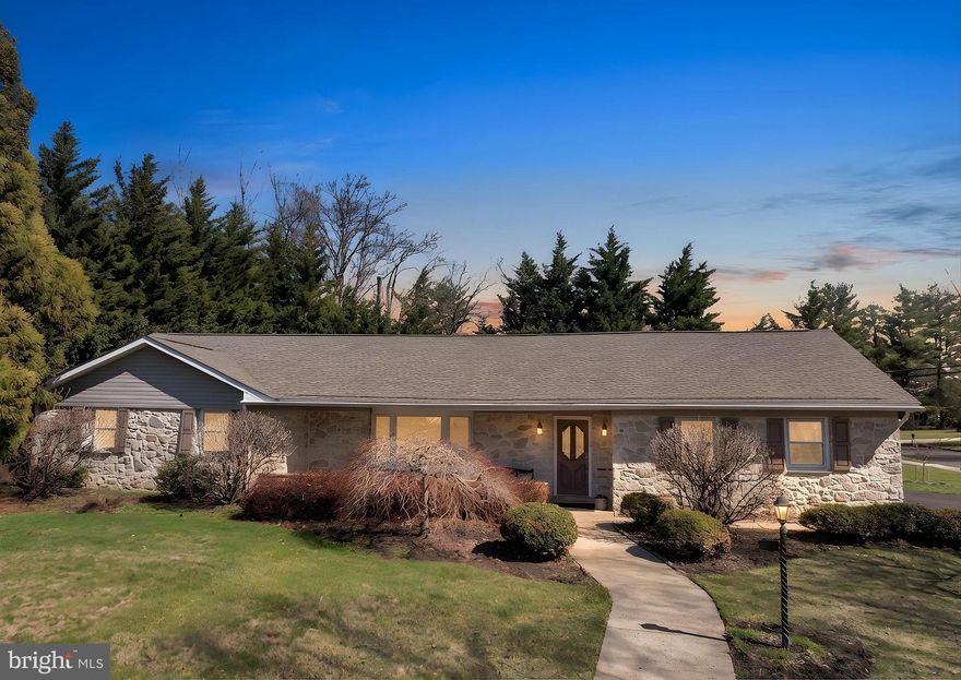 Welcome to 343 Andrew Road, a beautifully maintained ranch home nestled in the coveted community of Huntingdon Valley. Surrounded by mature landscaping and timeless stonework, this residence offers exceptional curb appeal and a warm, inviting presence from the moment you arrive. Step inside the welcoming foyer, where abundant natural light pours through oversized windows and gleaming hardwood floors flow seamlessly. The elegant living room, highlighted by a charming bay window, provides the perfect setting for quiet mornings with coffee or relaxed gatherings with guests. At the heart of the home, the thoughtfully updated kitchen features crisp white cabinetry, granite countertops, stainless steel appliances, and a skylight that fills the space with soft, natural light. The kitchen looks over a spacious breakfast area, where French doors lead to the backyard patio, ideal for indoor-outdoor entertaining. The great room offers a warm and inviting atmosphere, centered around a wood-burning stove with striking stone accent wall. Just beyond, a spectacular Florida room with vaulted ceiling and ceiling fans creates a bright and airy retreat. It's an ideal space to unwind, entertain, and savor everyday moments with loved ones. Practicality meets convenience in the spacious mudroom, complete with washer, dryer, and utility sink, along with direct access to the oversized two-car garage, offering generous storage. The primary suite is a comfortable and private haven featuring two generous closets and a beautifully remodeled en-suite bath with frameless glass shower and exquisite travertine tile flooring. Two additional spacious bedrooms offer ample closet space and share a well-appointed hall bathroom with double vanity and tub-shower combination. The impeccably maintained lot, with oversized garden shed, offers both privacy and charm in a picturesque neighborhood just a short walk to the elementary school. Recent improvements include a newer roof, generator, and water heater, replacement windows, and the home is offered with a complimentary one-year home warranty for added peace of mind. Located in the award-winning Lower Moreland Township School District and within close proximity to restaurants, boutiques, and major commuter routes, this exceptional property offers comfort, convenience, and timeless appeal. Schedule your private showing while this opportunity lasts.