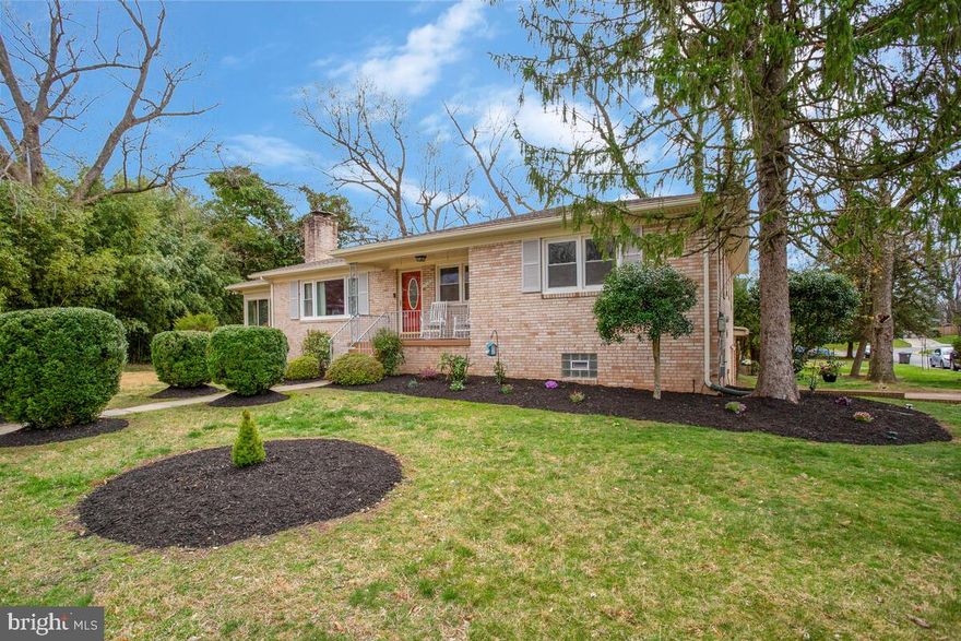 Beautiful Brick Rambler in hip, happening Hyattsville! Fabulous location on a corner lot facing on a cul-de-sac! Welcoming, covered front porch. Gorgeous oak wood floors throughout the main level! Gracious living room with picture-glass window & fireplace. The kitchen has ceramic-tile flooring, a window over the sink, granite countertops, wood cabinets, a cooktop and 2 wall ovens, plus a super-useful pantry!  The dining room has windows overlooking the back yard and connects the living room, kitchen & den - truly the heart of this lovely home! The den has windows on 3 sides including a sliding-glass door to the sunroom which leads to the tiered deck with stairs to the backyard - such a fabulous space for entertaining! The primary bedroom has 2 large closets, an on-suite bath and has 3 windows. Two additional main-level bedrooms face the front and share an updated full bath with dual sinks and a whirlpool shower/tub. The hallway has a pull-down staircase to the attic - great additional storage! The lower level walks out to the rear patio and yard. There's a spacious family room with surround sound speakers, a bar area, built-in storage/seating and 2 LARGE walk-in closets! The 4th bedroom has built-in bookshelves, 2 exterior windows and another walk-in closet! The third bath has a shower stall and accent wood wall. Enjoy a useful home office with built-in shelving and the fabulous Home Gym! Save your membership fees and workout at home! Ring Cameras surround property and convey!  4 Zone heating allows for personal comfort! All this PLUS a 2-Car Garage and located within the University Park Elementary School district.  Near METRO/MARC and the upcoming PURPLE LINE. At the backdoor of the flagship University of Maryland. This one is not to be missed!  You will love living here!