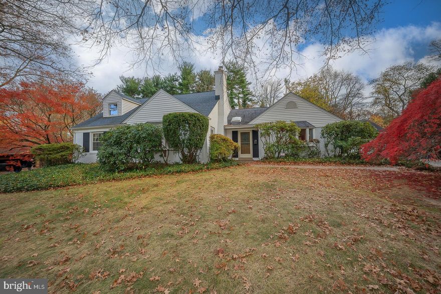 The best of all worlds – your private oasis in the middle of everything - can be yours! Nestled on a rarely available street in a park-like setting, this expanded, potentially-six-bedroom, cape cod style home sits in one of Wallingford's most desirable and coveted neighborhoods. With large lots, homes set far back, and mature trees and flowering bushes everywhere, this entire street is ablaze with breathtaking colors in Spring and Fall.  You can WALK to the nationally recognized elementary, middle, and high schools, the Wallingford train station (20 min to Center City), library, ball fields, parks, and stunning nature/hiking trails. This is a convenient, central location with easy access to highways, the airport, center city, and the vibrant town of Media with its shops, restaurants, professional theater, and festivals.  The unassuming front façade completely disguises the surprising, rambling spaciousness of this cape. Do not be fooled! A  large, bright, atrium-style foyer with a skylight and cedar closet greets you. To your right is a  Primary Bedroom with a wall-to-wall mirrored closet and en suite bath with a skylight, large Jacuzzi-style tub, and separate shower. Sliding doors lead to a private deck-for-two that connects to a larger multi-level deck that runs the length of the house, beyond which is a limestone terrace. Already you can feel the vibes of a forever home. To your left is an expansive Living Room with hardwood floor, built-in shelves and cabinets, stone fireplace with wood stove insert, casement windows, and a large bay window letting the light pour in. This space is just begging for holiday gatherings.  Beyond that at the center of the home is an efficient u-shaped Kitchen with many cabinets, granite counters, stainless appliances, and a huge picture window overlooking the back deck and yard. An adjacent Dining Area has room for a sizable table and chairs.  The flow of these major spaces in the home creates endless opportunities for entertaining or intimate just-family gatherings. Sliding doors from the Dining Area lead to a large Sunroom with skylights where you could watch movies or host a small gathering, while enjoying outdoor views, even in Fall and Winter. At over three-quarters of an acre, the fully fenced, multi-level backyard backs to school playing fields, offering terrific privacy for gardening, barbecues, and birthday parties. 2 additional bedrooms complete the main floor. One is very large, with hardwood floors, 3 closets, and built-in drawers; this would also make a terrific den, rec room, or gym. The second is a medium-sized room with wrap-around, built-in, desks, cabinets, and shelving, with verdant views of the rear yard, making it a natural choice for an amazing home office. These two bedrooms share a hall bathroom with an updated frameless glass shower and built-in linen storage. In addition to the 2-3 three bedrooms on the main floor, the upstairs has 2 large bedrooms, a smaller office/bedroom, and a shared bath. This whole floor could be a deluxe Primary Suite, Teen Suite with a den/study/rec room, or keep it simply as 2-3 bedrooms. The smaller office/bedroom includes some built-in cabinetry and large windows looking out to the backyard, giving this home the possibility of a second home office. A finished basement with tile floor rounds out the living spaces and offers recreation, Laundry, cedar closet, steel dog wash, and copious storage.  A detached 2-car garage and driveway for 4-plus, round out the exterior. Though this home is a diamond in the rough awaiting your vision and cosmetic touches, the heater is only 13 years old, the water heater is only 3 years old, the neighborhood is the stuff of dreams, and the floor plan offers the tremendous flexibility needed in modern lifestyles for recreation, entertaining, and working from home.