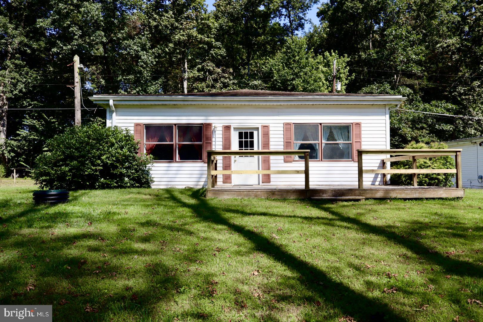 Discover the charm of this water front ranch-style home nestled in the serene Adams County. With 1,203 sq. ft., this residence features two cozy bedrooms and a full bathroom. With an open floor plan, the heart of the home is the well-appointed eat in kitchen and large living area, with access to the garage, providing easy access and additional storage. Step outside onto the deck to enjoy the view of the creek and the expansive 0.41-acre lot, offering ample space for outdoor activities or gardening. Embrace the lifestyle you’ve always wanted in this creek side home! Home is being sold as is.