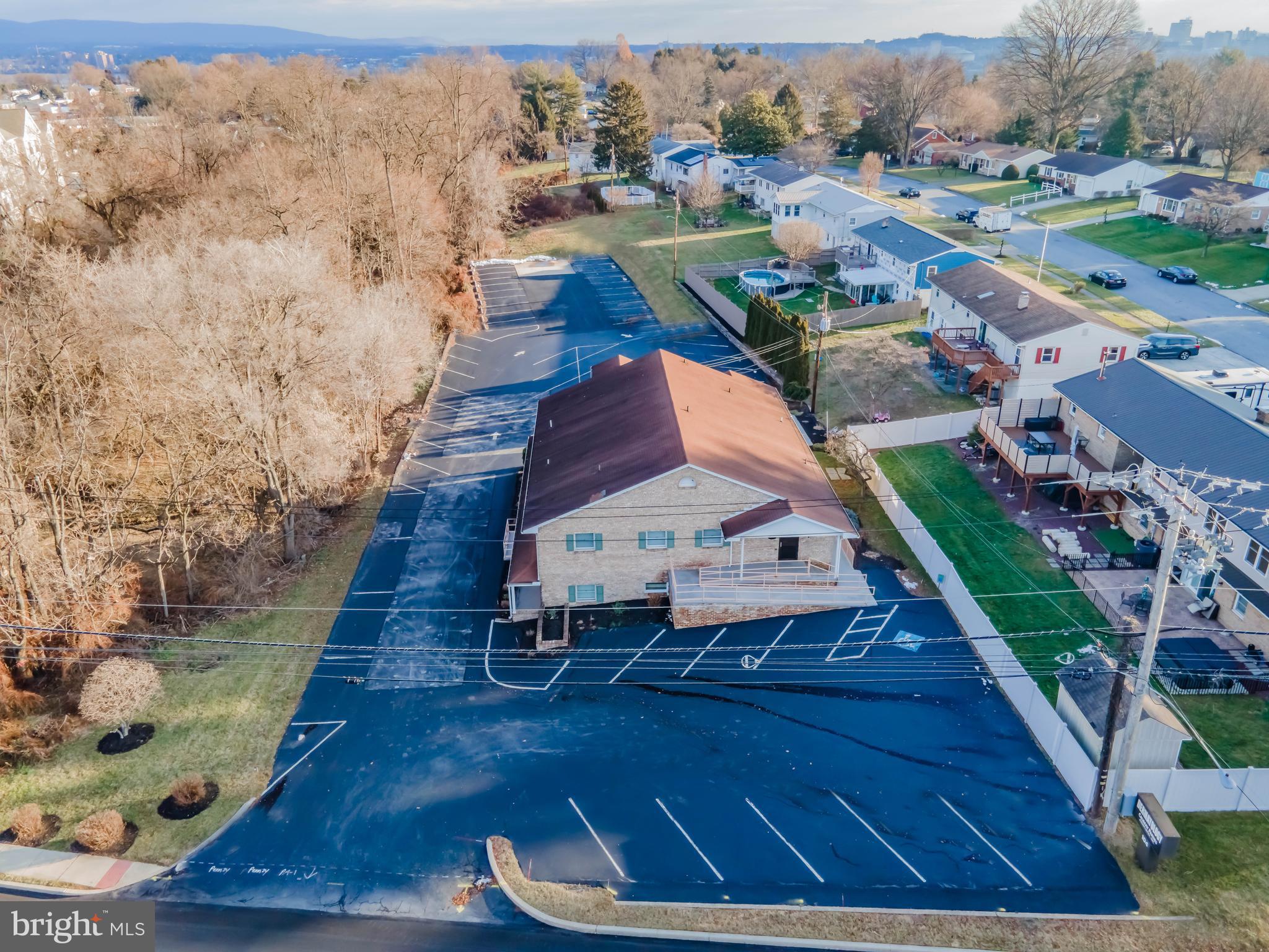 50% leased office building bringing in approximately $97,000/yr. in addition to current tenant paying half of all of the expenses associated with the building including property taxes, insurance, utilities and maintenance. Perfect for an owner/occupier who would want a tenant covering most of the building costs. Turn key medical/office building available in Camp Hill. Could be used for single or multiple tenants. Separate entrances for both floors. Each floor has a waiting room with reception desk, 4 restrooms, 7 exam rooms, storage rooms or rolling file cabinets, tech stations and back offices. There is an elevator, and each floor is handicap accessible. 55+ parking spaces. Convenient location, minutes from downtown Harrisburg, Holy Spirit Hospital and Harrisburg Hospital.