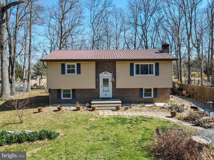 Back on the market due to buyer financing trouble. No fault of the property! This charming home is at the end of the road in a quiet, country setting. This home could easily be two separate units, as there is a kitchen, full bath, and two bedrooms on the upper level and another kitchen, full bath, and one bedroom on the lower level. Both levels have their own entrances, and the door in between can be locked. Downstairs would be great for in-law suite or rental, as it has separately metered electric and there are two hot water tanks. Wonderful backyard, backing to trees and full of possibilities: there's a tree fort, shed, chicken coop with fenced area, and lots of room for gardening. Many perennials are already planted, including asparagus, rhubarb, onions, tulips, daffodils, irises, hydrangea, lavender, bee balm, lilies, peonies, echinacea, and black eyed susans! Highspeed internet available through Xfinity. Schedule your showing today!