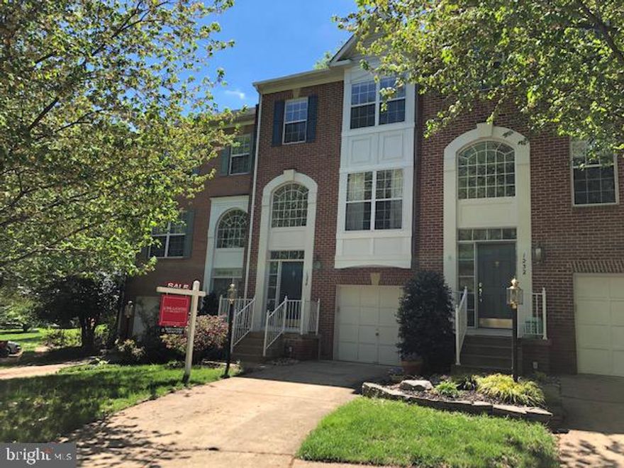 Classy, upbeat townhome features 3 bedrooms; 2.5 baths; 3 fully finished levels; garage. Open floorplan is sunny with a 2-story foyer.  House backs to trees with relaxing deck.  Hardwood flooring on main level; new carpeting o lower level Family Room.  Cozy 3 sided gas fireplace between Dining Room and Breakfast/Den area.  Spacious Master Bedroom with garden full bath, double vanity, separate tub and shower. Laundry on bedroom level.    Walk-out lower level features garage access, Recreation Room & walkout to rear yard + extra closet.  Excellent location near pools, shopping, major roads, Metro, dog park, etc.