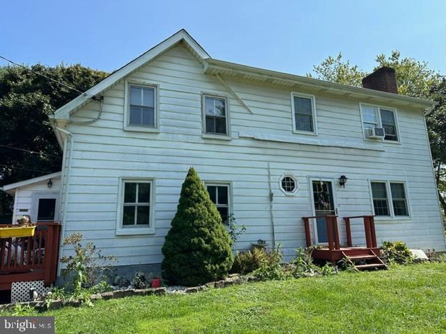 This home needs updating and TLC, but has so much potential for the right buyer.  It holds so much history!  Half the home was built in 1871, and the other half 100 years later!  It's a solid house - the builders showed great pride in craftsmanship and materials, so it will live on for many years to come!  At 2700 + sq ft, it offers 4 large bedrooms, one and one-half bathrooms, and plenty of common area space.   Beautiful hardwood floors throughout the majority of the home and a fireplace with a brick surround bring a warmth that is hard to match.  The kitchen has original beamed ceiling and offers a glimpse back in time with its exposed brick, harlequin-inspired cabinet fronts, and a Shaker-made island.  In the basement is an enormous wood stove that cranks out great supplemental heat!   Sited on 2.43 acres with multiple outbuildings, including a garage, a workshop, and a large storage shed, it has plenty of room for your cars, tractors, and whatever tools you could ever need, not to mention those animals you were hoping to get!  Beautiful views in a beautiful area - you can make it all your own.

This is a strictly As-Is sale - Seller will make no repairs.