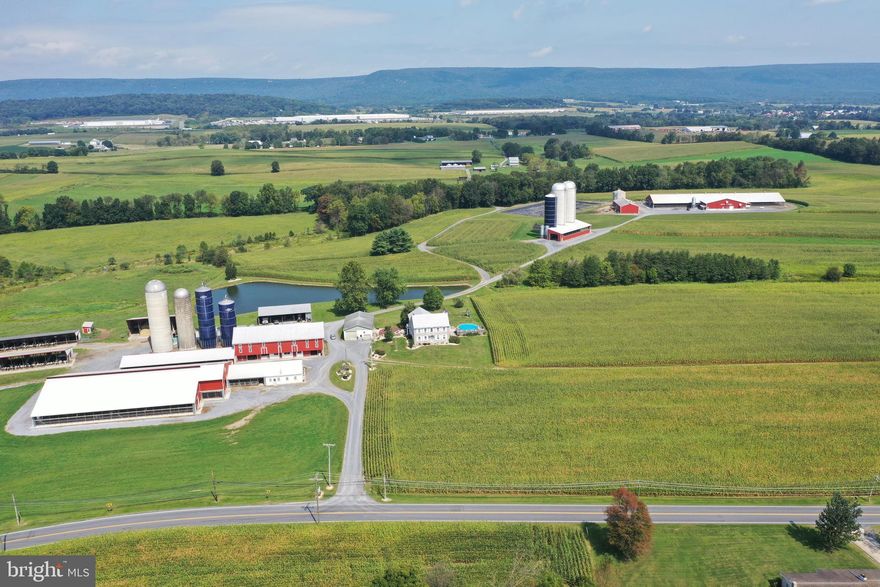 305-acre modern dairy farm with (4) model A-3 Lely robots. Insulated barn includes 223 freestalls, Norbco alley scrapers, and Petersheim pasture mats. Milk house features 7,000-gallon Mueller milk tank with radiant in-floor heat. 156-stall dry cow and bred heifer barn. Calf barn that accommodates 50 calves. 50-head heifer barn with 6 pens built in 2009. 14 pen slatted floor heifer barn built in 1991 can accommodate 98 heifers. Includes a manure digesting system and separator barn. 2 feed areas accommodating 7 silos with conveyors all under roof. All for just $5,000,000 or 127-acre main farm with all dairy facilities can be purchased for $3,250,000.