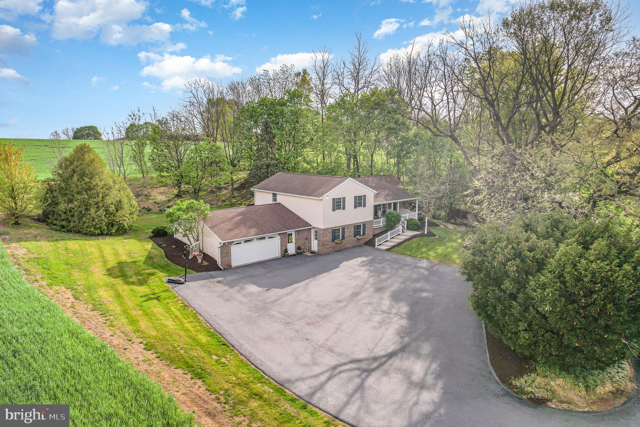 Welcome to this spacious four-bedroom, two-bath split-level home situated on 3 acres in Warwick School District, just north of downtown Lititz. Enjoy beautiful farm views from every angle while still being just minutes from town conveniences.
The home features an oversized two-car attached garage, central air, and central vac throughout for everyday comfort and convenience. Inside, you’ll find a bright and inviting layout with plenty of natural light. The family room features a propane gas fireplace and access to the deck and back yard. Upstairs you'll find three spacious bedrooms and a full bath, while the fully finished lower level offers a large office, full bathroom, additional bedroom, generous storage, and extra living space.
This expansive lot provides room to roam, garden, or simply relax and take in the scenery. It’s been well-cared-for and is move-in ready offering the perfect opportunity to add your personal touches.