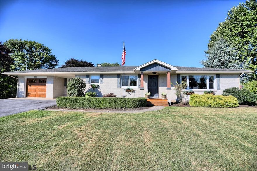 You need to see this gorgeous updated 2334 sf 3 bedroom 2 and a half bath home with a 1 car attached garage and a 1 car detached garage in the awesome Shawnee Hills Development! Large eat -in updated cherry kitchen with included SS appliances, huge dining room with large window, sitting room with double sided stone propane fireplace, stunning large living room on the other side of the stone propane fireplace with access to the beautiful  large stamped concrete patio. Off the living room, you will find beautiful master suite with an attached bath and a  walk-in closet. 2 additional bedrooms and full bath are off the sitting room. The hall off the kitchen leads to a large laundry room, a half bath, and the garage. Large basement is mostly finished with a spacious rec room and a separate  office or workout room. The utility/storage room  and an additional separate storage room should be adequate for your storage needs. Oil hot water heat and main floor mini splits  provide heat and cooling. 200 Amp electric service. Detached 1 car garage with workshop area and a second floor for storage. Nice yard with a raised bed garden and a firepit. Minutes from Rt 322 and amenities. This one is worth taking a look! Call today!