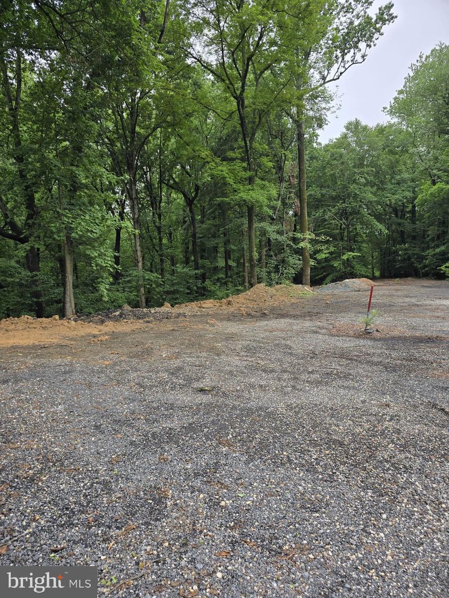 Embrace the tranquility of 13.85 scenic acres nestled in a designated Tree Conservation Area—perfect for nature lovers seeking privacy and potential. With 4 acres of clearable land, this expansive homesite offers the ideal setting to build your custom dream home while preserving a natural woodland backdrop. Enjoy the convenience of public water and private septic would be needed. Zoned Rural Residential, this property blends peaceful living with smart development opportunity. A rare find with room to grow and breathe.