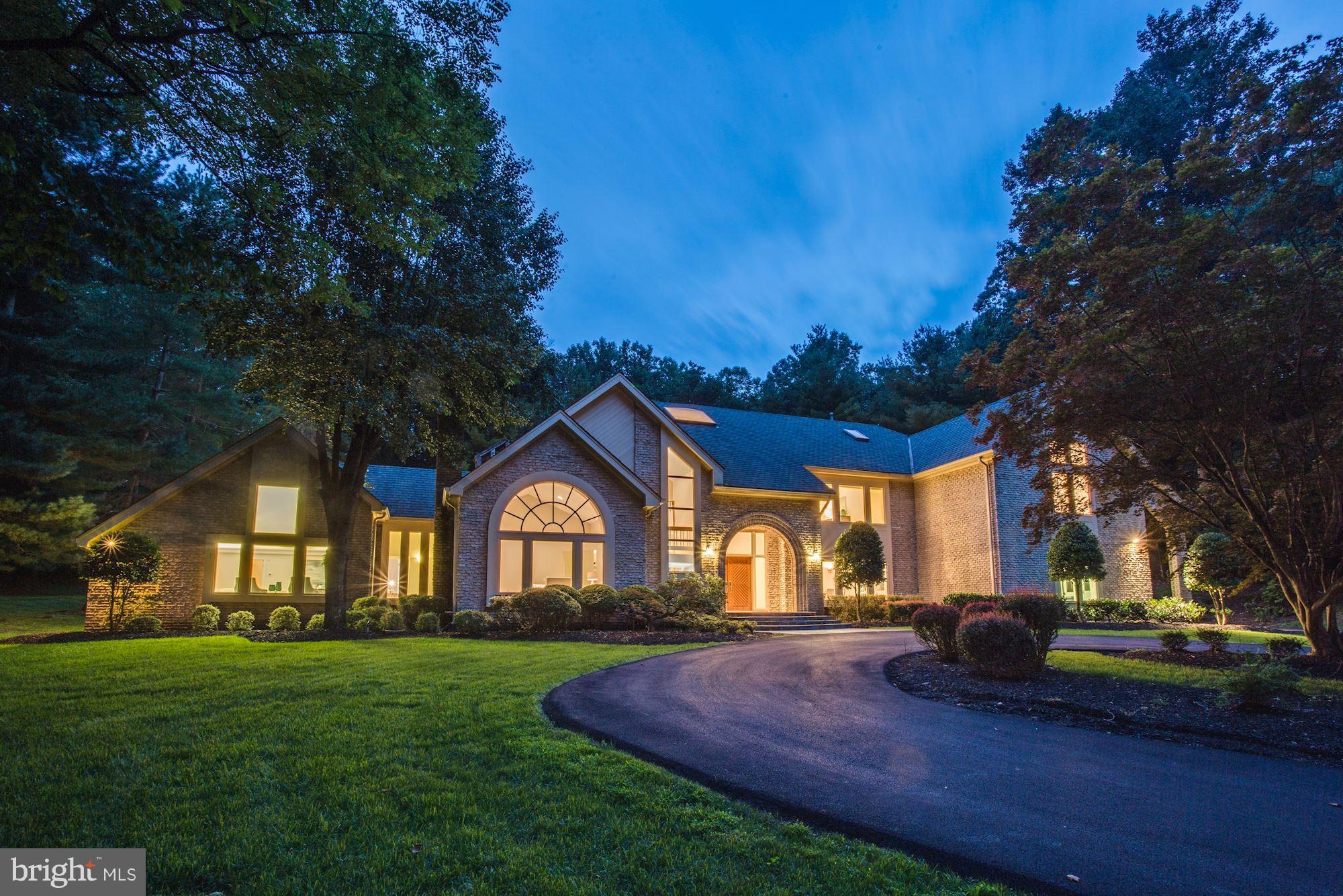 NEWLY RENOVATED estate on 2.2 private acres. Marble two story foyer, new Red Oak flooring & drenched with sunlight. Stunning, brand new gourmet kitchen with custom cabinetry, quartzite countertops, two walk-in pantries & never used, top of the line appliances. Decadent main level master suite with 2 walk-in closets, vanity, steam shower, tub and view of the pool. Adtl 4 beds/2 ba up with bonus room, 1 bed/ba in basement with fitness room, recreational space, and unfinished storage area. Heated pool and lit tennis court.