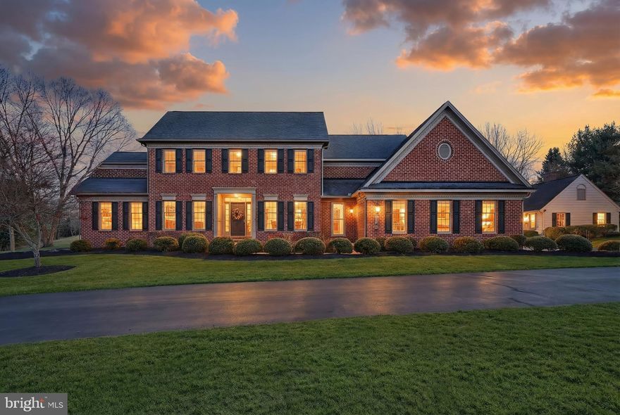 Experience the perfect blend of elegance, functionality and privacy in this custom-built brick traditional 2 story home set on 2.6 private acres. Conveniently located near shopping, dining and amenities, this property offers a tranquil retreat with every modern convenience.
The quality built home features 4 BR's and 3.5 bathrooms, including a luxurious 1st floor bedroom suite with large walk-in closet. The first level also includes a formal living and dining room,  spacious family room with fireplace, private office/den, and a custom designed kitchen with island and large sunroom/eating area with lots of sunshine for spectacular views. There is a large laundry room with cabinets and sink.  Conveniently located 1st floor powder room.  Adjacent to the kitchen and large eating area/sunroom is a screened in porch with a TV and awnings. Perfect for relaxing with beautiful landscaping with a view of the pool. Like new hardwood flooring throughout.  The second story offers 3 additional bedrooms, 2 bathrooms, and an expansive closet area with built-ins, and additional attic storage.
Vaulted ceilings, crown molding, trey ceilings, and professionally designed interiors reflect meticulous attention to detail throughout the home. The home also  includes a whole house generator.
 Lower level is unfinished  with a gym area featuring  rubberized flooring and professional grade exercise equipment.  
There is a 3 car attached  heated garage with stairway to lower level for ease of storing outside furniture.

Detached custom built carriage house with wood stove and a separate area for lawn equipment and tools. Lots of storage on the second level for more storage. This carriage house was built by Edward H. Nace Restoration Co. 
Enjoy the in-ground  heated pool that was all redone with Gunite in 2022.  The patio overlooking the pool offers a private setting and perfectly located for more entertaining and relaxing. 

You will appreciate the professionally landscaped lawn and the long private driveway leading to a stunning entrance. 
The home was custom built by Richard J. Smith &  Sons giving lots of thought to design and quality for an unmatched living experience.