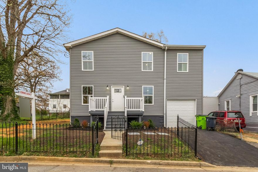 Totally renovated colonial on a large fenced corner lot.  This home features brand new roof, siding, windows, HVAC system, deck front and back.  Beautiful wood floors on main and upper levels, large kitchen with granite counter tops with all new stainless-steel appliances, walkout to deck from the kitchen, formal dining room off the kitchen , kitchen access from the two car garage.  Upper level features 2 large owner suites with beautifully renovated bathrooms, 2 additional bedrooms, and full hall bath.  Washer/dryer hookup on upper level.  Main level has a bedroom and half bath.  Basement is perfect for entertainment/recreational. Close to D,C. and public transportation.  This home is being sold as-is.  Exterior and Interior photos coming soon.