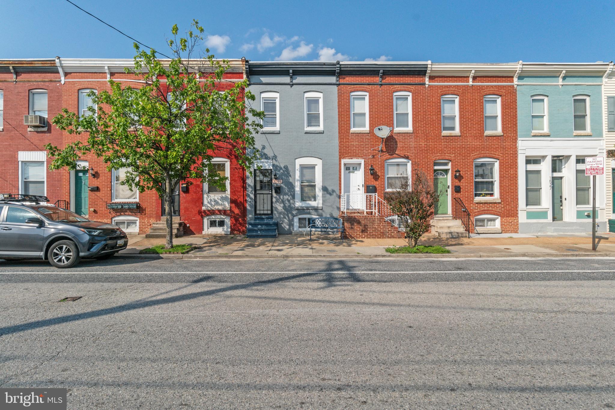 Welcome to 1521 Bush Street – a beautifully reimagined 3-bedroom, 1-bath rowhome tucked away on one of Baltimore’s best-kept secrets. This fully renovated gem sits quietly in a rare residential row offering unexpected peace and privacy in the heart of the city. Step inside to discover gleaming, brand-new hardwood floors that stretch throughout the home, setting the stage for modern living with timeless charm. The bright, open layout flows seamlessly into a stunning new rear deck, perfect for morning coffee or evening gatherings. Downstairs, the finished basement adds versatility with a cozy den featuring custom built-ins—ideal for a home office, reading nook, or creative space. Whether you're a first-time buyer, city-loving professional, or savvy investor, this home is a rare find in a uniquely quiet, tucked-away pocket of Baltimore. Don’t miss your chance to own a fully updated home with style, space, and serenity—schedule your showing today!