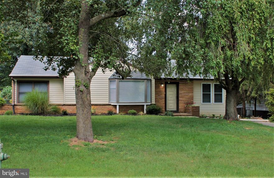 This home was recently renovated and shows well.  The mature landscaping and trees provide shade and privacy.  The rear yard is fenced and you'll find a 10x23 trex and vinyl deck, perfect for grilling, picnics and relaxing under the large shade trees.  
Step through the front door and you'll find a spacious living room and formal dining room complete with bay windows, wood burning fireplace and ceiling fan.  The dining room includes space to seat 6 comfortably.  Adjacent, and open to the living and dining room, is a new addition that includes a massive kitchen, breakfast area, main floor laundry room, half bath, and multiple pantries.  The kitchen includes granite counters, stainless steel appliances, counter-top lighting, LED recessed lighting, upgraded cabinets, double bowl sink, and sliding glass doors to the rear deck and yard.  This massive open space is certain to be the center of any home entertaining, dinner parties, holiday parties and more.  This area even includes space for a second living/family room.  The possibilities are endless with the amount of floor space offered.  
Located just down the hall from the kitchen you'll find 3 large bedrooms and full bath.  The bedrooms offer multiple closets and storage options.  The bath has just been renovated and includes a tile tub/shower combo, tile floors and modern vanity and fixtures.  
The home also includes a large finished lower level complete with rec room, family room, utility room and additional storage room.  The rec room and family room are open to each other and include recessed lighting, ceiling fans and a wood burning fireplace.  There's plenty of space for large sectional furniture, flat screen TVs and game tables.  The two storage rooms on this level guarantee plenty of space for seasonal items.  The home includes a new heat pump heating/cooling system, LED lighting and energy efficient windows, helping to reduce energy cost.