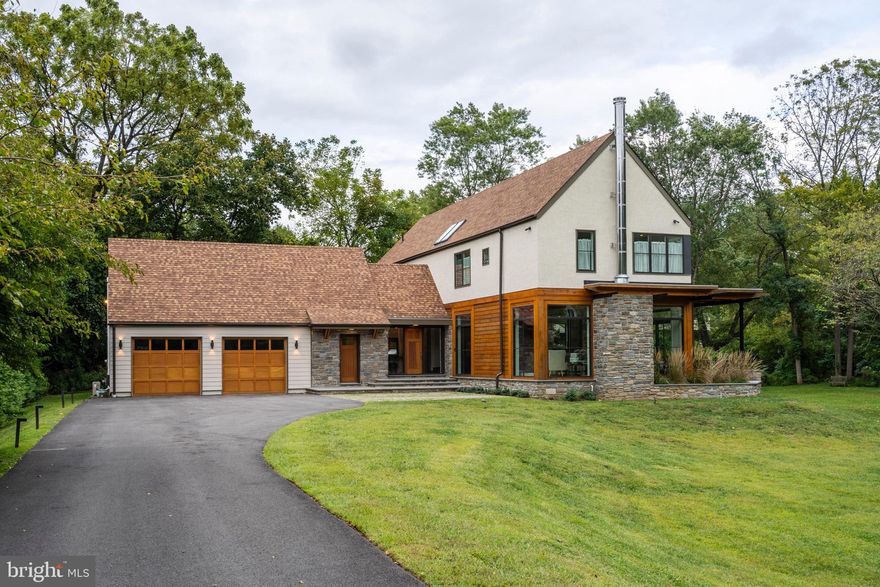 Take advantage of a rarely offered opportunity to make your home on one of the most desirable streets in the area, situated on a picturesque, serene 1 Acre lot in Wyndmoor - a wonderful Philadelphia suburb. Architects and builders have chosen many distinct features that will make this property architecturally unique to fit perfectly with the stunning exterior landscape. Summary of Interior/features include: Open first floor layout with spacious living room highlighted by exposed joists, wood-burning fireplace with Wissahickon Schist stone border and custom built-ins. Kitchen includes top end appliances, dual ovens, two sinks, substantial pantry, and a built-in seating overlooking the covered patio. Expansive dining room allows for large gatherings. Pass through the first floor office/playroom off of the kitchen to the den, which can be used as a theater room, playroom, or guest room, even large enough to make a first floor master (full bathroom attached). A powder room off the foyer rounds out the first floor. 2nd floor features a master suite with beautiful bathroom and spacious walk-in closet. 3 additional bedrooms, 2 shared baths and 2nd floor laundry are also housed on this floor. Stunning skylight above the stairway enhances the architectural appeal of the property and produces an abundance of natural light. Top end Kolbe Vistaluxe Architectural series windows are installed throughout the house. As if the house itself isn't enough, there is a finished space above the 2-car garage with endless possibilities, complete with a full bath. Energy efficient heating and cooling throughout the house.