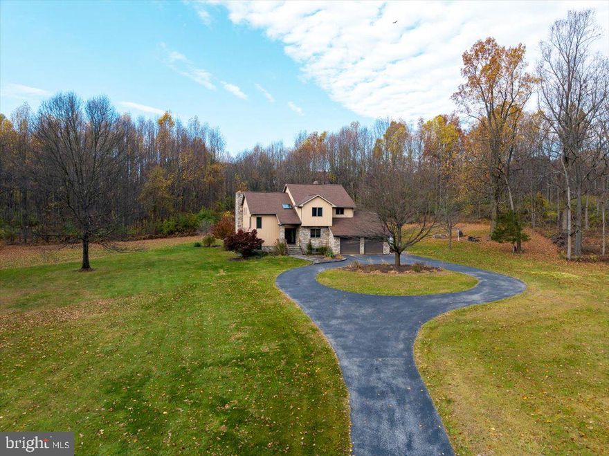 LOOK NO FURTHER! If you are looking for privacy and country living while still being just minutes away from
conveniences, this one is for you. Situated on almost 8 acres in Oley Valley Schools, this home is surrounded by
tranquility and beauty from every window. Upon entering you will immediately be impressed with the open concept
Great Room/Dining area with vaulted ceilings and skylights. Enjoy cozy winter nights in front of your wood burning
fireplace, or warmer weather entertaining outdoors with your outdoor BBQ area. This home has been custom designed
by the homeowner and was built by Angelo Corrado. The home features 3 bedrooms, and office area, or use the main
floor office as a 4th bedroom. The master bedroom, has a newly finished master bath, with walkin shower, double bowl
sinks, tiled floor and heated towel rack. The convenient and spacious 2nd floor laundry area is unique with a sink,
laundry bins, shelving and built in ironing board. The basement is plumbed for a full bath and Flue for potential fireplace.  The painted and drywalled  garage is oversized  with extra space for work area, storage, or extra toys.    It also has high ceiling with kayak/canoe hoist. & utility sink. The property extends past tree line and is bordered by rock wall.   There is so much to mention,
but not enough room here to list.   See attached list in document section.  Make your appointment today, before you miss out!
