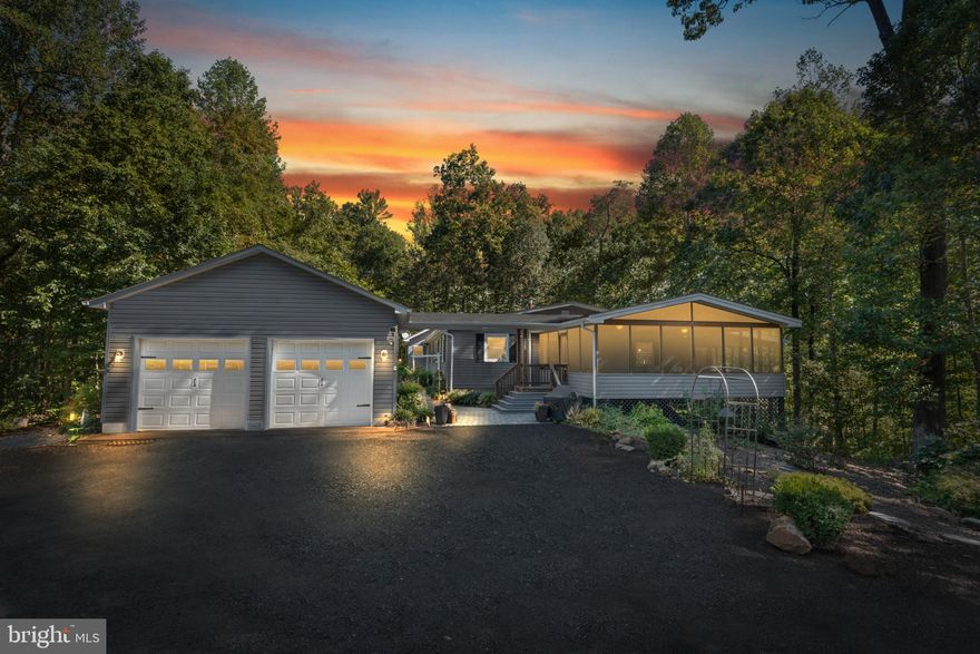 Update! VA Assumable Mortgage at 5%! Discover a captivating blend and distinctive vibe of modern comfort and timeless craftsmanship in this stunning rambler, nestled on a sprawling 6-acre lot surrounded by serene wooded views. Built in 1981, this residence has been meticulously renovated (2019) and is in excellent condition, showcasing the perfect balance of style and functionality. Step inside to find an inviting open floor plan that seamlessly connects the living spaces. The family room, adorned with exposed beams and a cozy corner gas fireplace, creates an ideal setting for relaxation and gatherings. The gourmet kitchen is a chef's dream, featuring upgraded countertops, stainless steel appliances, and a spacious island that invites culinary creativity. A generous pantry ensures ample storage for all your kitchen essentials. The home also boasts formal dining space and a huge sunroom, as well as, a grilling porch. This home offers three well-appointed bedrooms, including a primary suite with a luxurious walk-in closet and an en-suite bathroom featuring an incredible walk-in shower and private screened porch. The additional bedrooms are perfect for guests or a home office, providing flexibility to suit your lifestyle. Enjoy the convenience of main-floor laundry, making daily chores a breeze. Step outside to experience the beauty of nature from your expansive screened in porch, perfect for entertaining or simply soaking in the tranquility of your surroundings. The property also features a screened-in porch, ideal for enjoying warm summer evenings. With additional structures including a second RV garage and a shed, there's plenty of space for hobbies, storage, or even a workshop. The exterior of the home is equally impressive, with durable vinyl siding and an oversized semi-attached garage, along with off-street parking for guests. The lush, wooded lot offers privacy and a peaceful retreat, making it a perfect escape from the hustle and bustle of everyday life, whether it's around the patio or in the beautifully designed gardens. With its unique design, exceptional craftsmanship, and thoughtful features, this home is more than just a place to live; it's a sanctuary where memories are made. Don't miss the opportunity to make this extraordinary property your own and experience the perfect blend of comfort, style, and nature. Schedule your private tour today and envision the lifestyle that awaits you!