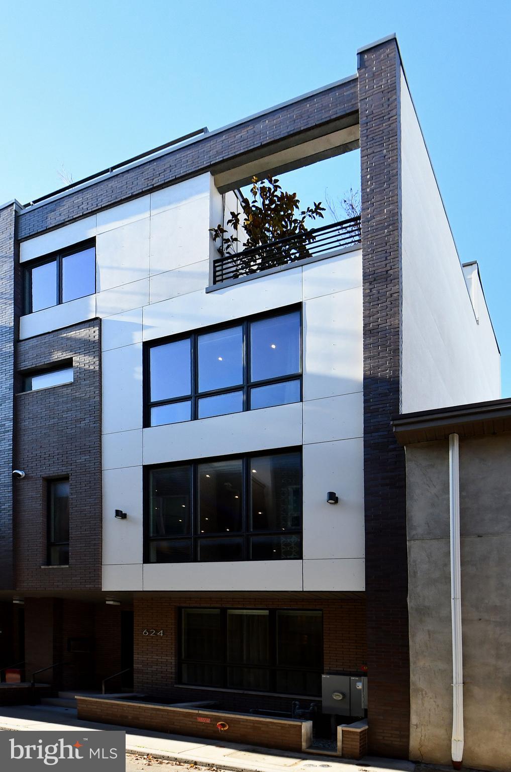 ***Open House Sunday, June 1 - 1:00 - 3:00PM***Prepare to be captivated by the most spectacular townhome anywhere in the city of Philadelphia! Designed, built and equipped for the most discerning of buyers, this home exudes the utmost in quality, craftmanship, amenities and a location that are second to none. Barely five years young, the home shows like a brand new model home and is in mint turn-key move-in condition. Featuring a 6 stop elevator traversing 5 gorgeous finished levels of living space of approximately 5,500 square feet and huge rooftop terrace ( as well as three additional outdoor spaces for a total of 1,100 square feet outdoor space ), 2 car secured gate INDOOR garage entry, and the finest details imaginable from top to bottom. An array of the finest materials such as walnut floors, 18”x 36” porcelain floor tiles, metal railings, stunning doors, baseboard trim compliment the neutral appointments throughout and are sure to please the eye. There is literally not one component of this home that is not upgraded and / or customized. Each floor offers the chance for a quiet retreat or sophisticated entertaining. The main entry on Bodine St. and garage entry from the 3rd St. side serve as bookends to a large living room, closet and half bath. One level below is the most magnificent entertainment room, replete with custom cabinetry, wine storage for 600 bottles, 75” TV ( can accommodate larger ). Adjoining is a large flexible space for casual dining with a well-appointed wet bar providing the service for this room and another half bath. One level above the entry floor is the heart of the home. The magnificent chef’s kitchen, with Wolf and Sub Zero appliances, giant island w/seating for 4, granite counters and backsplash, custom cabinetry and custom floating ceiling open to a formal dining setting with fabulous light fixture and wall of windows. The giant family room, with gas fireplace centered amongst built- ins galore and can accommodate a 108” TV, has a wall of windows that open to the tiled and fully fenced in deck with seating for 25+. Level 4 hosts three bedrooms (one w/en suite bath), additional full hall bath, laundry room and utility room. The bedrooms are spacious, bright and airy, with walk in closets, ceiling fans and large window coverage. The bathrooms are all gorgeous, with heated floors and impressive tile. The entirety of level 5 is the amazing owner’s suite. The bedroom is giant, with a large seating area, two walk in closets and wall of windows. An east facing deck is perfect for your morning coffee. The owners bath feature huge soaking tub, floating vanity and unbelievable shower w/ Kohler electronic and thermostatic shower controls not seen anywhere. We have finally made it to the top floor pilot house with another spacious east facing deck, and a huge west and north facing deck which can easily accommodate 40+ people. It has a built in Viking kitchenette and endless sunset views! Other features include 10’ ceilings, whole house Lutron Ra Smart System for lights, fans and auto shades, ample indoor and outdoor security cameras, 3 Zone HVAC, 2 tankless water heaters, water filtration system and much, much more. Approximately 4+ years remain on FULL tax abatement. Great location in vibrant Northern Liberties, walk minutes to fabulous dining and shopping, and just three minutes off I-95. If you seek a one-of-a-kind special home that has it all, this is your next stop. Available immediately for quick move-in.