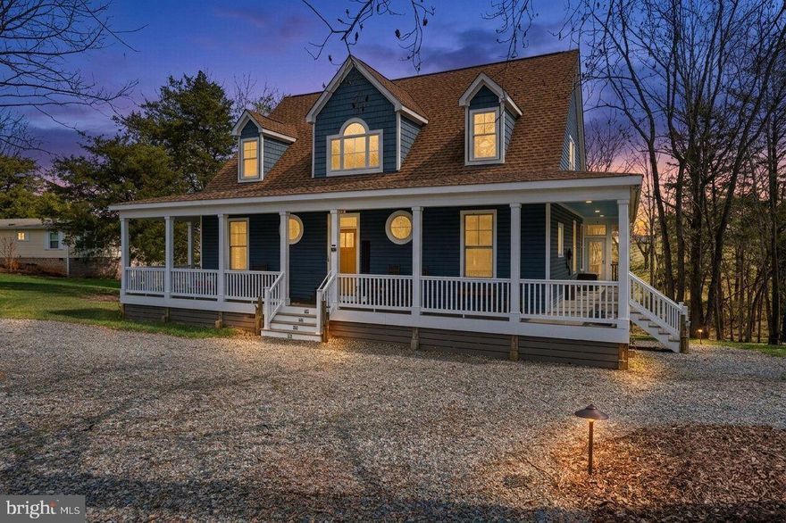 Welcome to Claude's Cove @ Lake Anna! This custom built Cape Cod offers timeless curb appeal and invites you to slow down and enjoy lake life. Best of all, this home is being sold furnished, making it even easier to start enjoying everything it has to offer. Inside, the wide foyer opens to a spacious family room with vaulted ceilings, a fireplace, and plenty of room to gather. The chef’s kitchen features custom cabinetry, soft close drawers, undercabinet lighting, upper lit showcase cabinets, a huge granite island with seating for 6, a built in coffee and tea bar, and a breakfast nook with built in seating and storage. The open layout allows for beautiful views of the lake, backyard, and seasonal fireworks. The first floor primary suite offers screen porch access, a walk in closet, and an ensuite bath with double sinks, a soaking tub, and separate shower. A bright office or play area completes the main level. Upstairs are 2 oversized bedrooms, each with built in dressers and space for 3 beds, plus a full bath with a charming porthole window. The walkout basement has its own entrance and is perfect for guests or extended family with a game room, kitchenette, Murphy bed, sectional sofa, full bath, and storage. Outside, enjoy the wraparound deck, screen porch, firepit, hammock, frisbee golf, outdoor shower, and 2 outbuildings. The sellers are subleasing  a boat slip any remainder of time they will convey and HOA dues will convey, adding even more value and convenience. This is more than a home, it’s a destination!