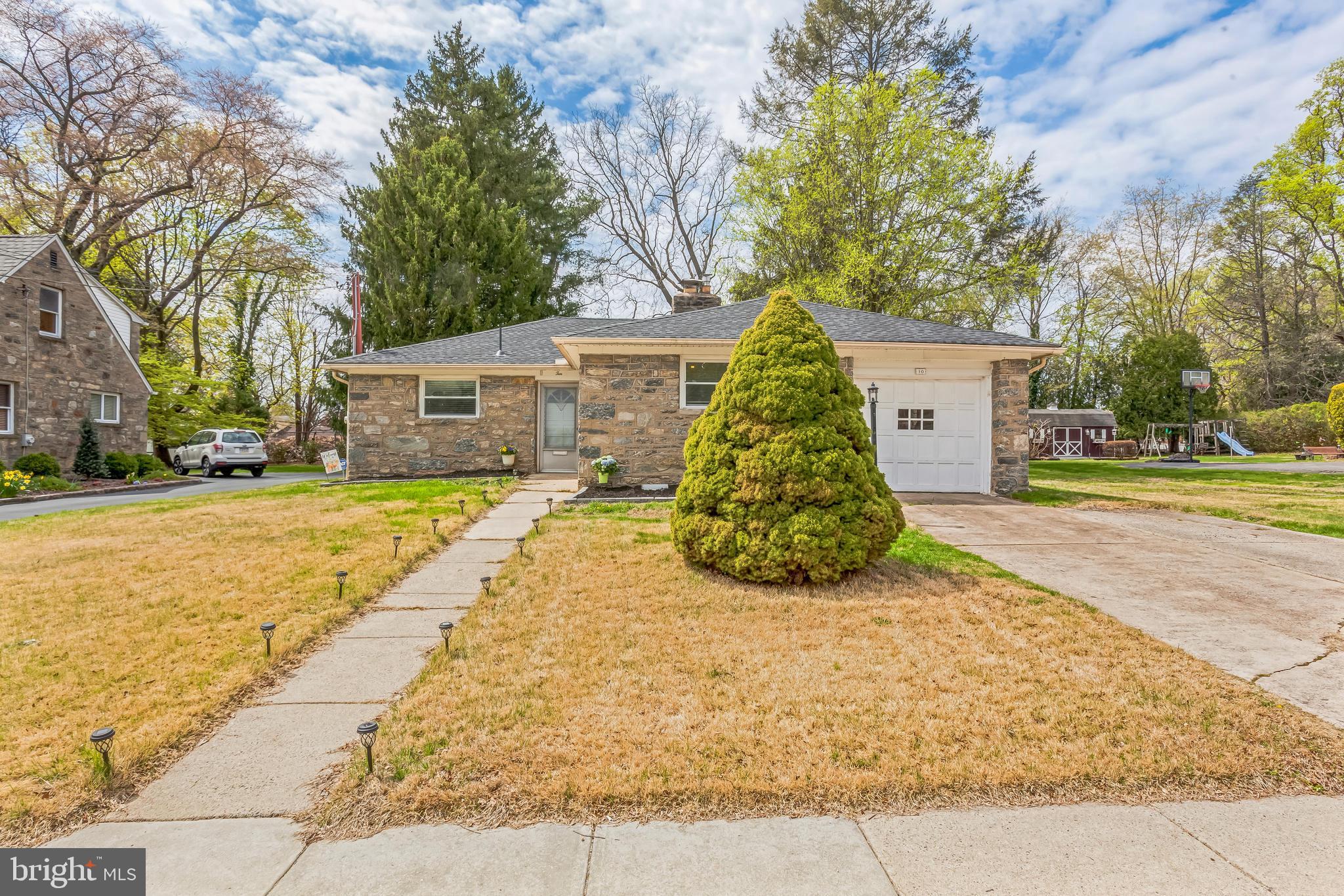 If you've been on the hunt for single floor living, this home is a must see! Situated on a quiet block in Lansdowne, a neighborhood that has the allure of a small town feel while being surrounded by local conveniences like grocery stores, shopping centers, and parks. Other attractions include the historic Lansdowne Theather, Nile Swim Club, farmers markets, and various community events. Enjoy easy access to public transporation and a quick commute into the Philadelphia and main line areas. Upon entering 10 Arbor Lea Rd, you immediately feel at home. While cozy and charming, this home offers an abundance of living space, lined with solid hardwoods throughout. The open living and dining area features a wood burning stone fireplace and access to a large enclosed patio. The cheery kitchen features white cabinetry and natural light. The full bathroom has been updated with modern finishes and offers a separate tub and stand up shower stall. The door to the bathroom is oversized and can accomodate wheelchair access. Each of the four bedrooms are comfortably sized with closets. The front bedroom also has direct access to the garage and basement areas. The basement offers additional storage and the laundry area. The garage can be used as even more storage, as there is driveway parking for 2 cars and ample street parking. Last but not least, the spacious back yard can be transformed into a true outdoor santuary with solar lighting and plenty of areas for seating, fire pit, and other activities. Recent upgrades include a new roof with warranty, new oil tank, and lighting and electricial upgrades throughout. Schedule your showing today!