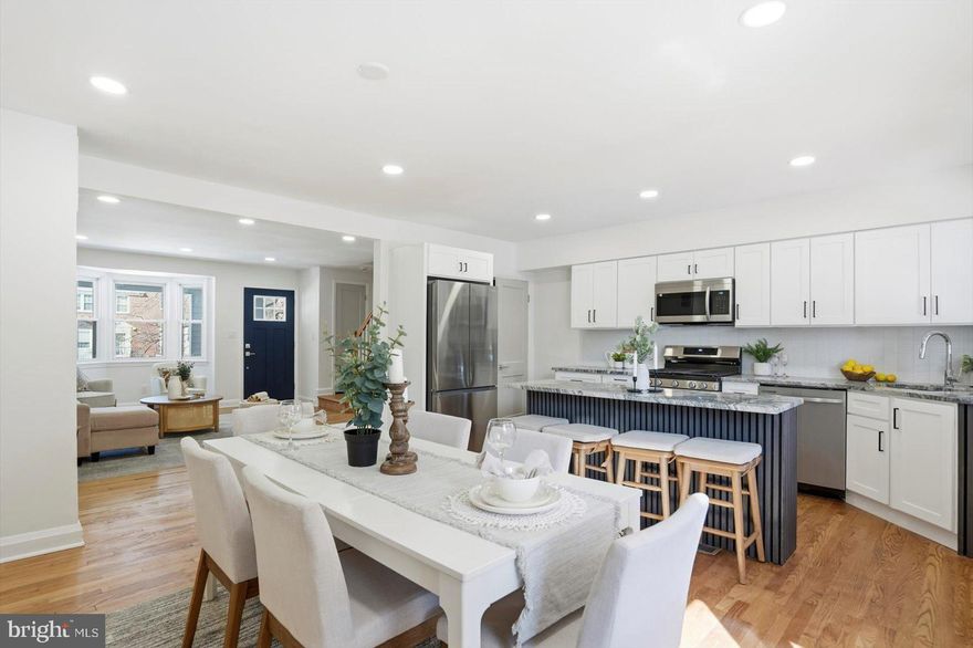 Stunning rowhome in desirable Woodbourne Heights offering the perfect blend of charm and modern updates. Gorgeous hardwood floors flow throughout the main and upper levels, complemented by abundant natural light and recessed lighting that create a warm, inviting atmosphere.

The beautifully updated kitchen is a true showstopper, featuring granite countertops, tile backsplash, stainless steel appliances, gas cooking, and a spacious island that provides both additional storage and a convenient breakfast bar. Step right off the kitchen onto a large deck — perfect for entertaining — overlooking a fully fenced backyard.

Upstairs, you’ll find three generously sized bedrooms and a well-appointed full bath.

The fully finished lower level boasts brand new carpet, a spacious family room, and a versatile fourth bedroom or home office. An additional full bath with custom tile work and a walk-in shower adds both comfort and convenience.

This home truly has it all — style, space, and functionality — in a fantastic location!