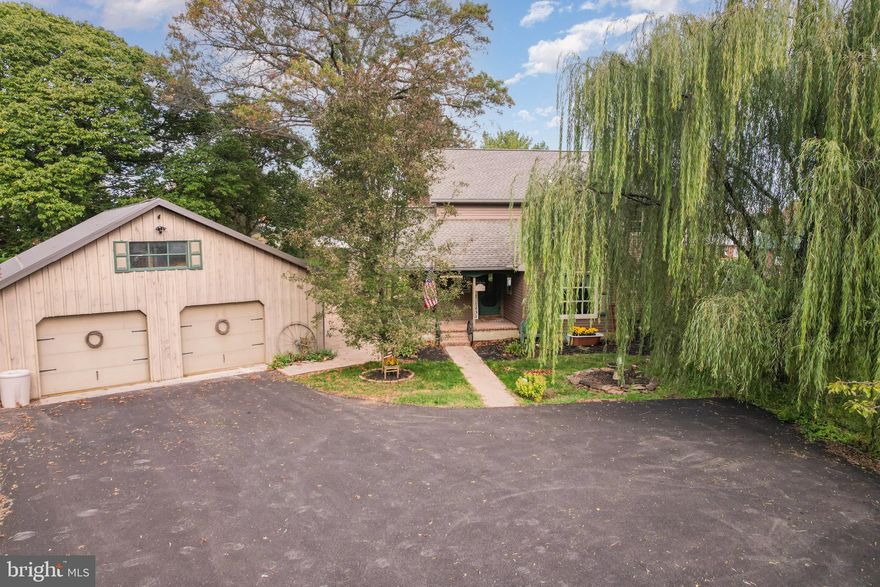 Every now and then, a home comes along that feels like it was made to stand out, and this one does it in all the right ways. Set well back from the main road and surrounded by a peaceful backdrop, this beautifully reimagined 4-bedroom, 3.5-bath farmhouse offers more than 3,100 square feet of finished living space designed for people who value comfort, character, and room to breathe.

The sellers planned for this to be their forever home, so they invested in thoughtful, high quality upgrades without cutting corners. This property has also been pre-inspected, and there are no major issues to worry about, offering even more confidence as you step into your next chapter.

Inside, the home’s classic farmhouse character blends with modern updates that bring both style and function. The main level welcomes you with refinished hardwood floors, fresh paint, and a warm, inviting kitchen that feels as practical as it is beautiful. New quartz countertops, a subway tile backsplash, wood cabinetry, a fireclay farmhouse sink, and standout appliances including a ZLINE oven, KitchenAid dishwasher, and French door fridge create a space meant to be lived in and enjoyed. A new drop zone, first-floor laundry, and a large walk-in pantry make day to day life easy and efficient.

The improvements continue throughout with new lighting in every room, updated bathrooms, all new toilets, and new flooring in the kitchen, laundry, and pantry. The fully finished lower level adds an impressive amount of flexible living space with an additional bedroom, full bath, multiple closets, and a cozy gas-fireplace living room. Smart upgrades include waterproofing by 58 Foundations, egress windows, a Bilco door, and a radon mitigation system, all providing comfort and peace of mind.

Upstairs, the primary suite offers a refreshed bath, and the new central air system installed in July 2025 keeps every level comfortable year round.

Outside, the property becomes its own private retreat. The expanded and resealed driveway provides extra parking, while brick paver walkways and patios connect multiple outdoor living areas, including a firepit pad perfect for evenings under the stars. The fenced yard, with three entry points and an electric fence, is framed by thoughtful landscaping that includes 13 fruit trees, berry bushes, and even a chestnut tree. The shed now features updated lighting and outlets, and the fully renovated garage with insulation, drywall, sealed floors, upgraded electric, keyless entry, and a mini split heating and cooling system is perfect for a workshop, gym, or studio.

From the new roof to the chimney repair and relining, every improvement reflects the care and long term vision the sellers poured into this home. And with a quick close possible, moving forward is easier than ever.